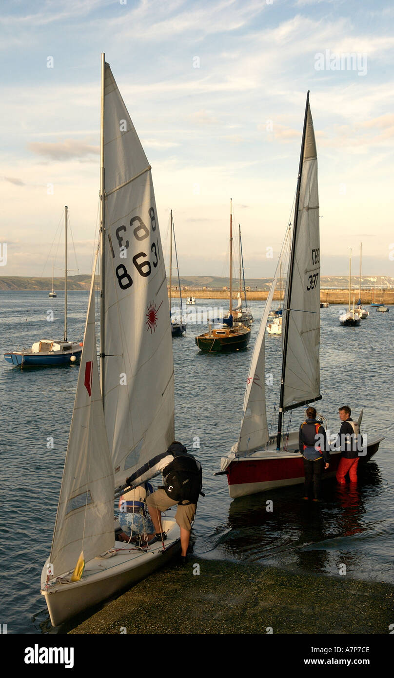 Launching International and Olympic Laser class sailing dinghies one