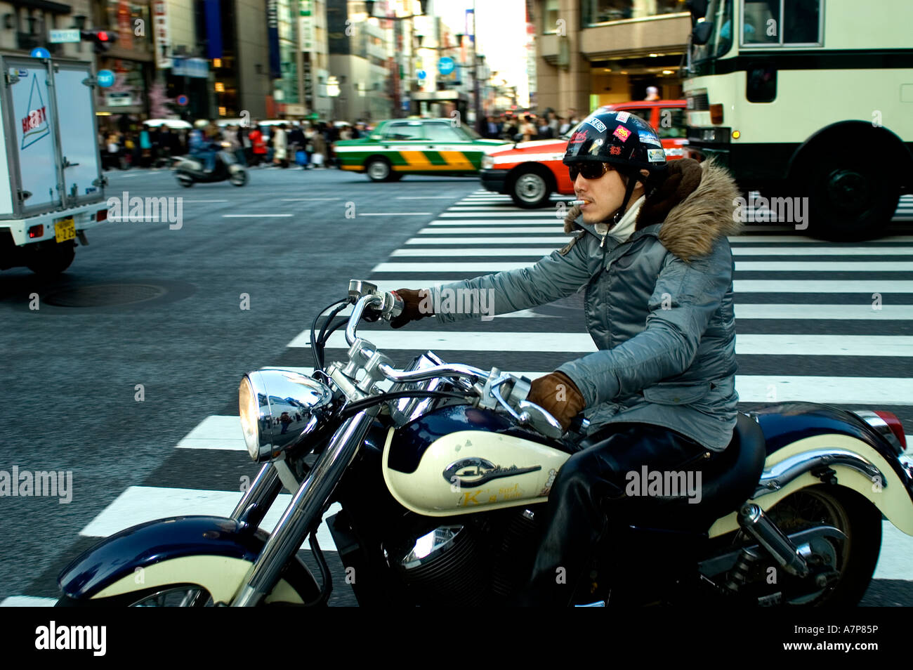Ginza Tokyo s smartest shopping area taxi cab motorcycle bike motorbicycle motorbike traffic Harley Davidson Stock Photo