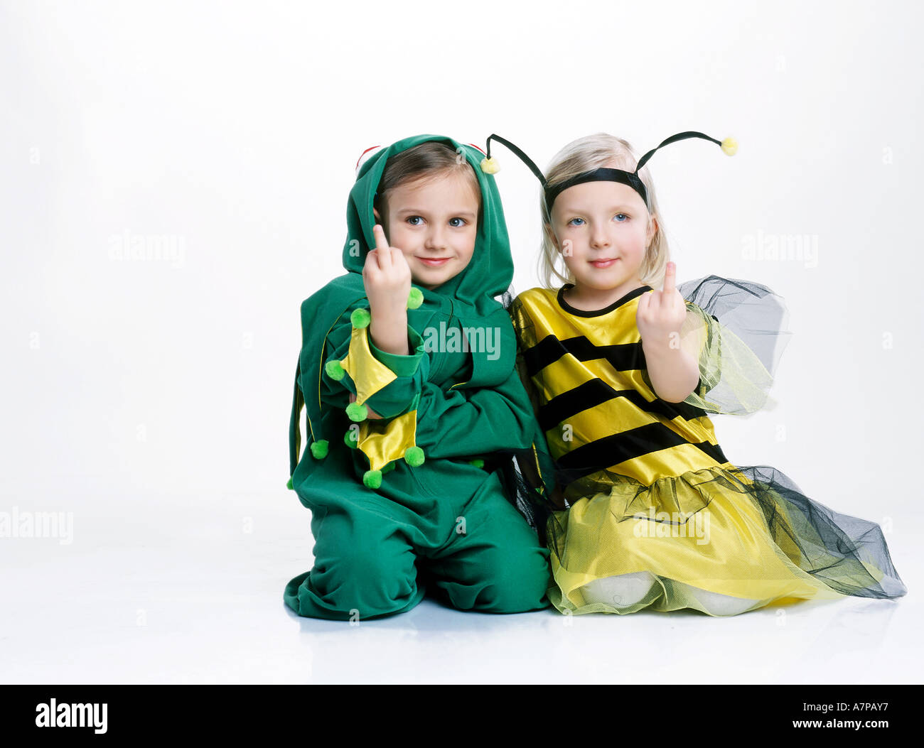 children fucking children indoor studio girl girls child childs kid kids 5 10 blonde smile smiling  facial expression sit floor gesture sign symbol fuck Stock Photo - Alamy
