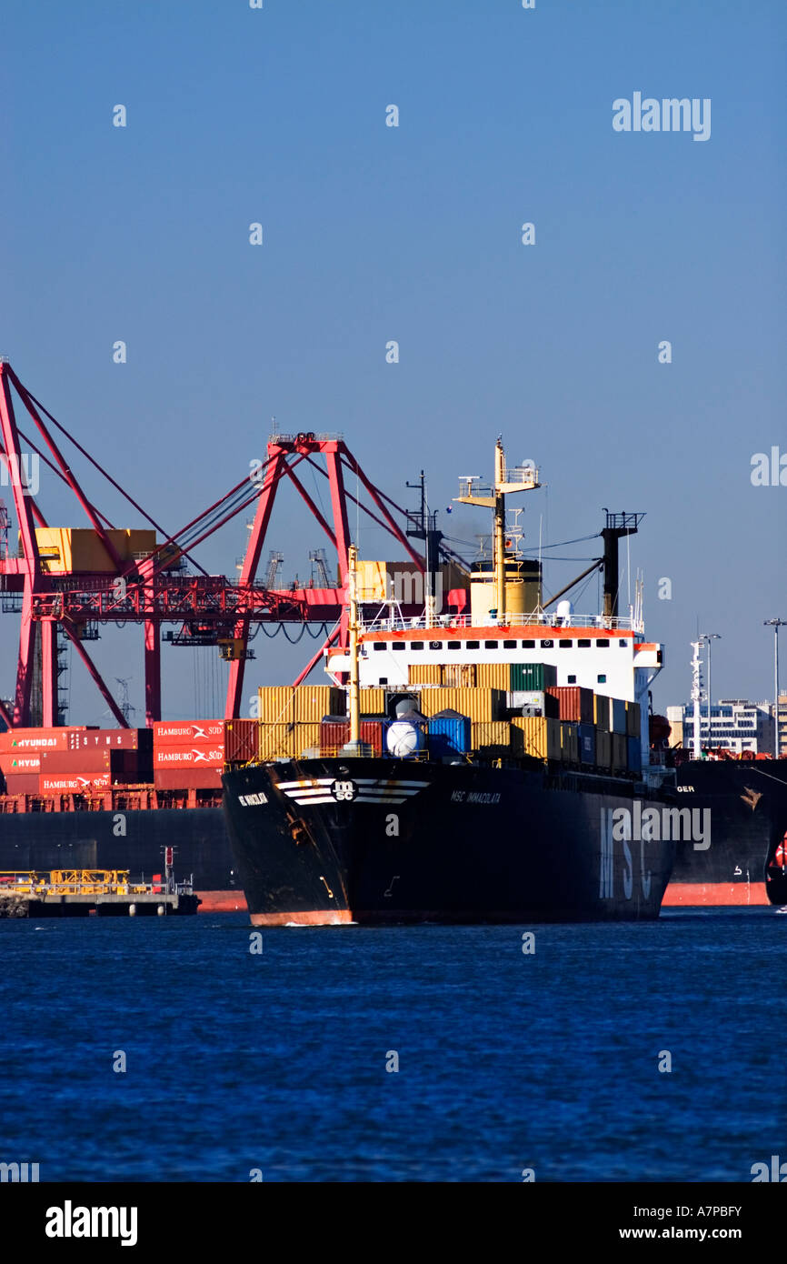 Shipping Industry / A container ship is outbound in the Port of