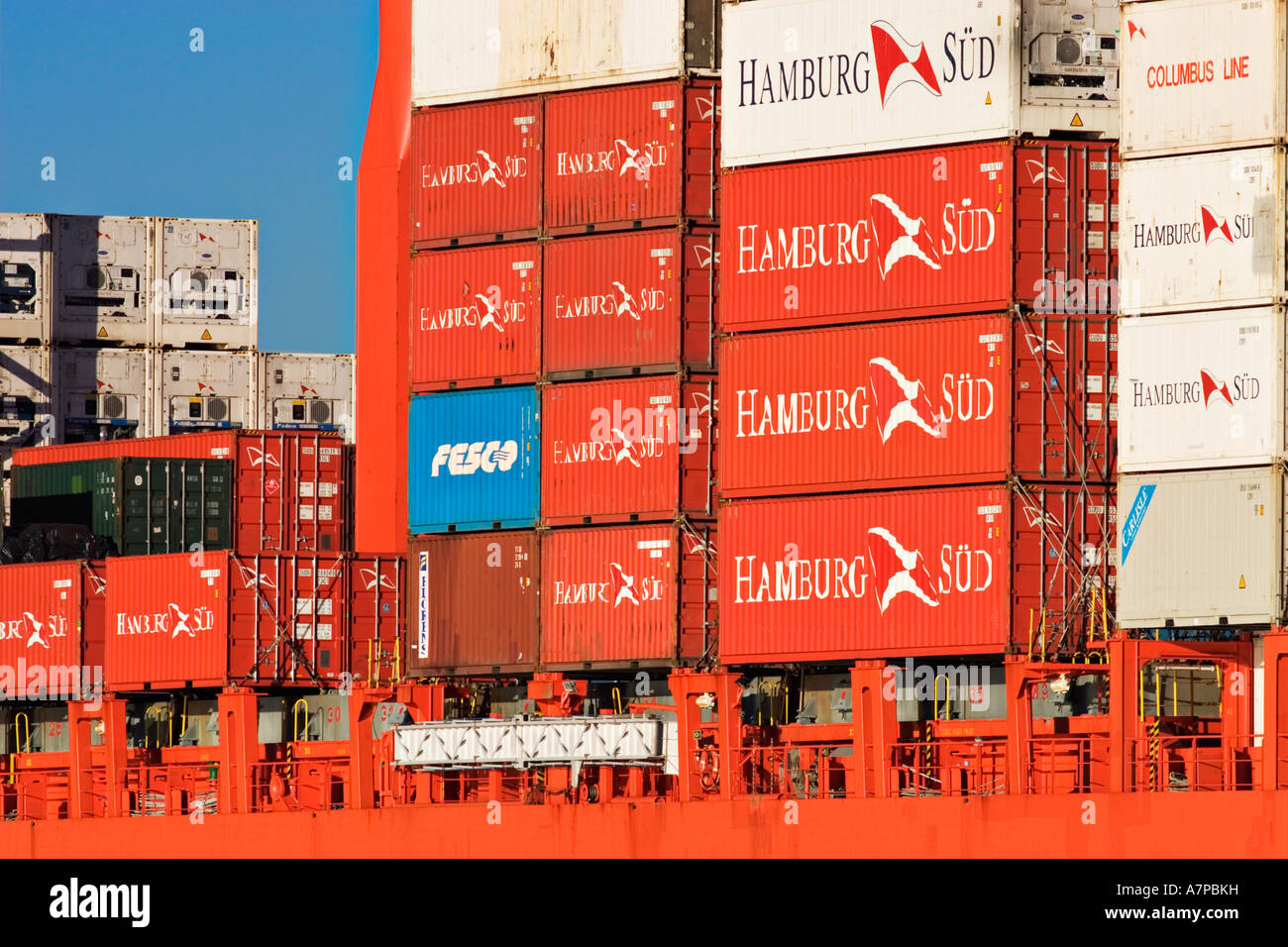 Shipping Industry / Shipping Containers stacked on the deck of a