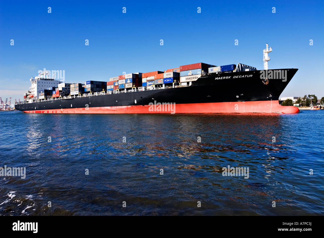 Shipping Industry / A container ship is outbound in the Port of Melbourne Australia Stock Photo