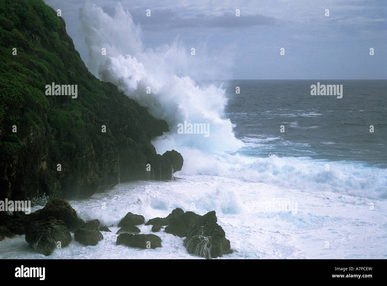 Sea cliff and storm surf from Super Typhoon Sudal Philippine Sea Island of Guam USA April 2005 Stock Photo