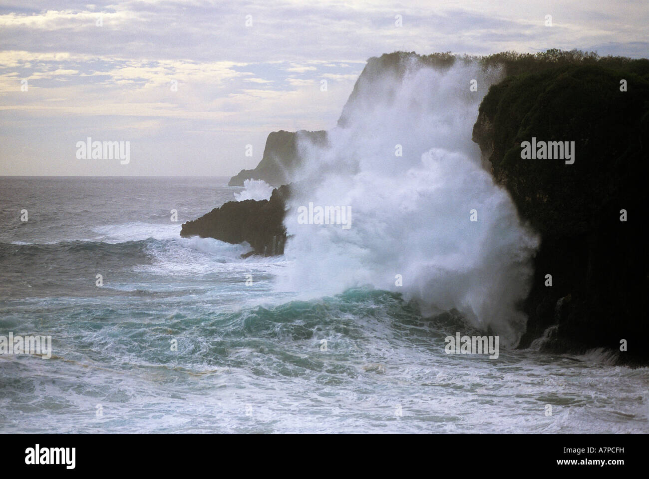 Sea cliffs and storm surf from Super Typhoon Sudal crashing against sea cliffs Island of Guam USA Stock Photo