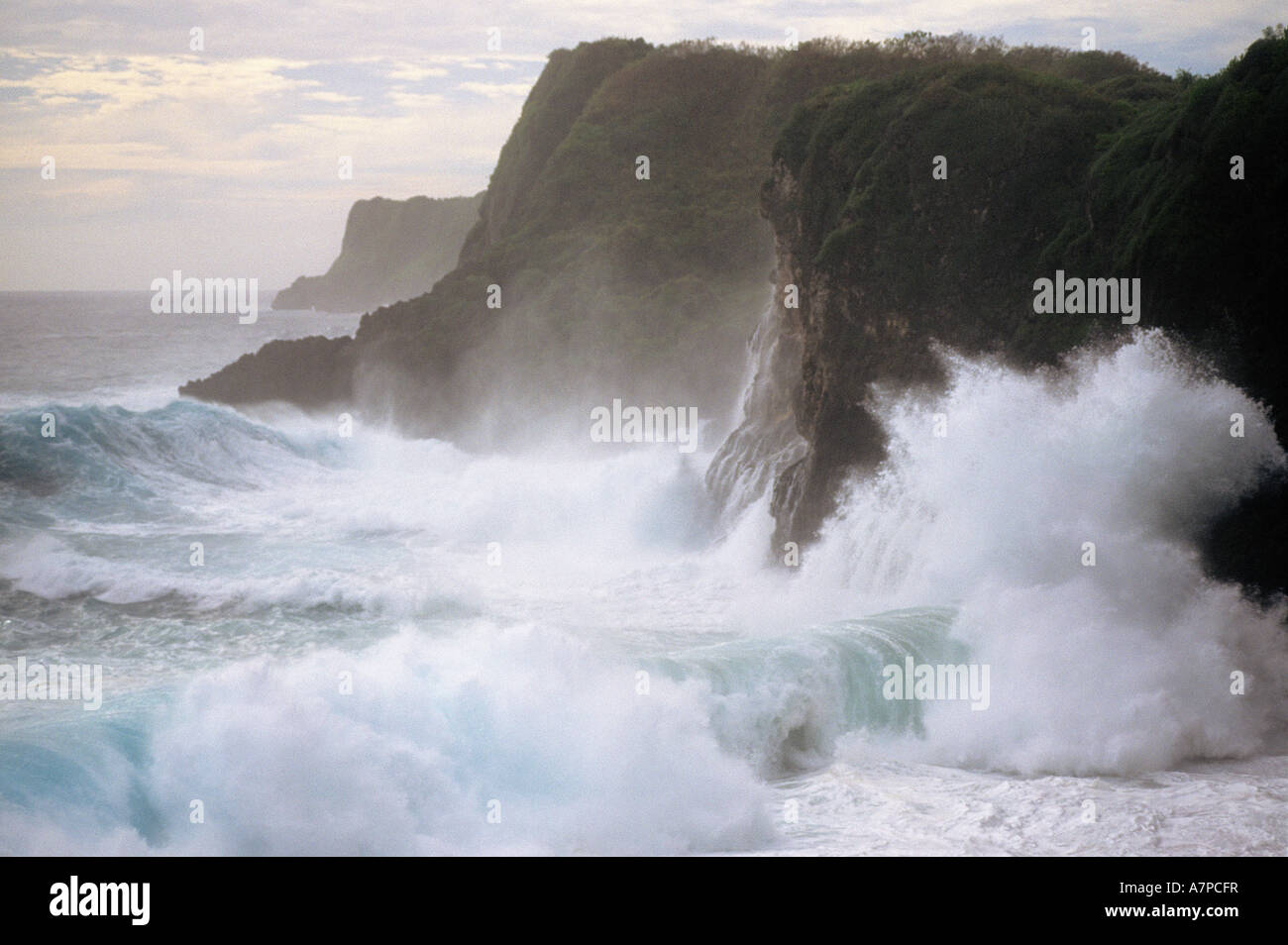Storm surf from Super Typhoon Sudal crashing against sea cliffs Island of Guam USA Stock Photo
