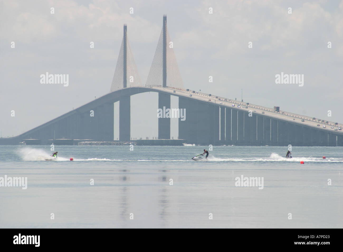 Florida Pinellas County,St. Petersburg,Tampa Bay water inlet,Sunshine Skyway Bridge,overpass,link,connection,visitors travel traveling tour tourist to Stock Photo