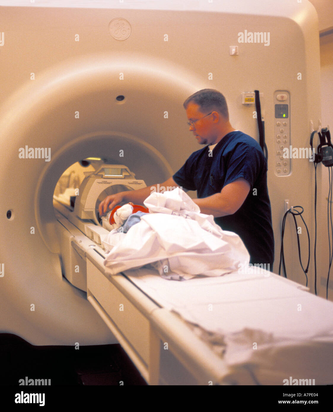 Resonance Imaging MRI machine being used to scan and diagnose a four year old girl