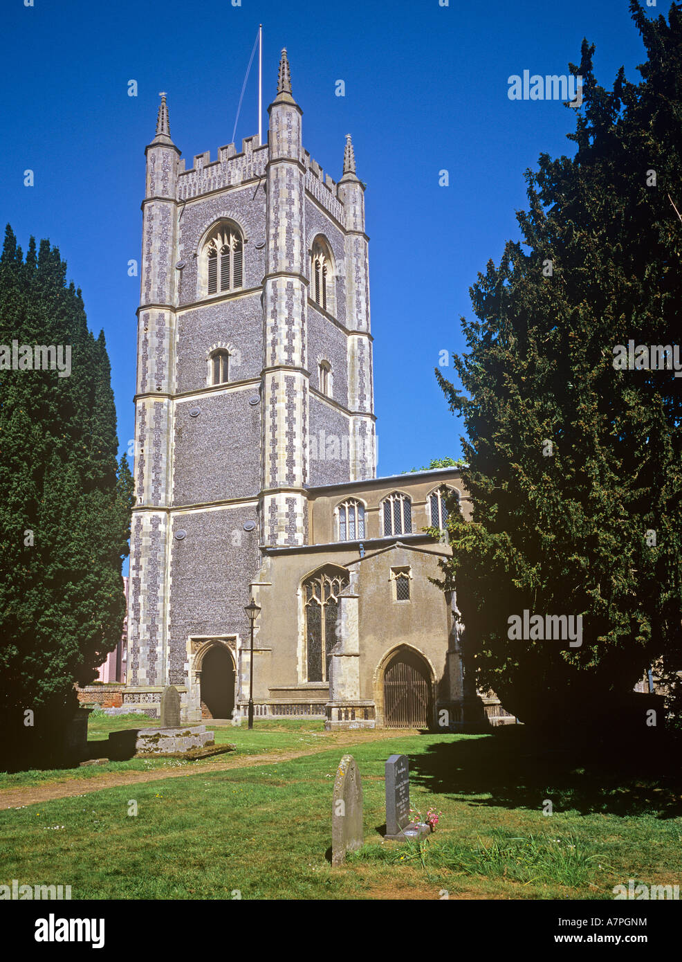 graveyard and high tower of The Church of St Mary Dedham Essex Perpendicular style Stock Photo