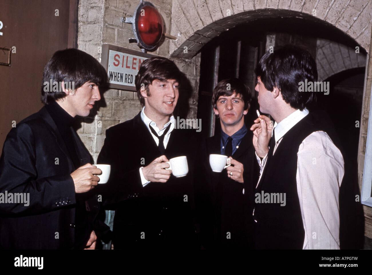 BEATLES take a break back stag at a theatre in 1964 Stock Photo