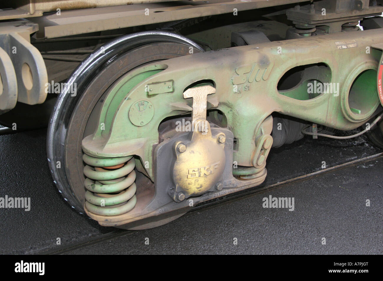 Large bogie on modern rail wagon showing heavy springs. Stock Photo