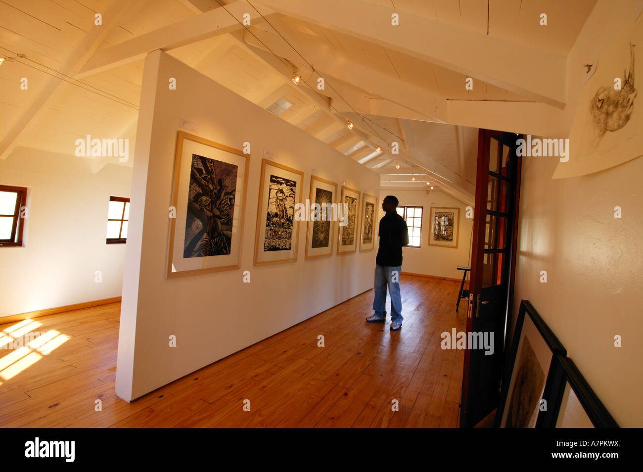 A tourist in an art gallery displaying African art in Graskop Mpumalanga South Africa Stock Photo
