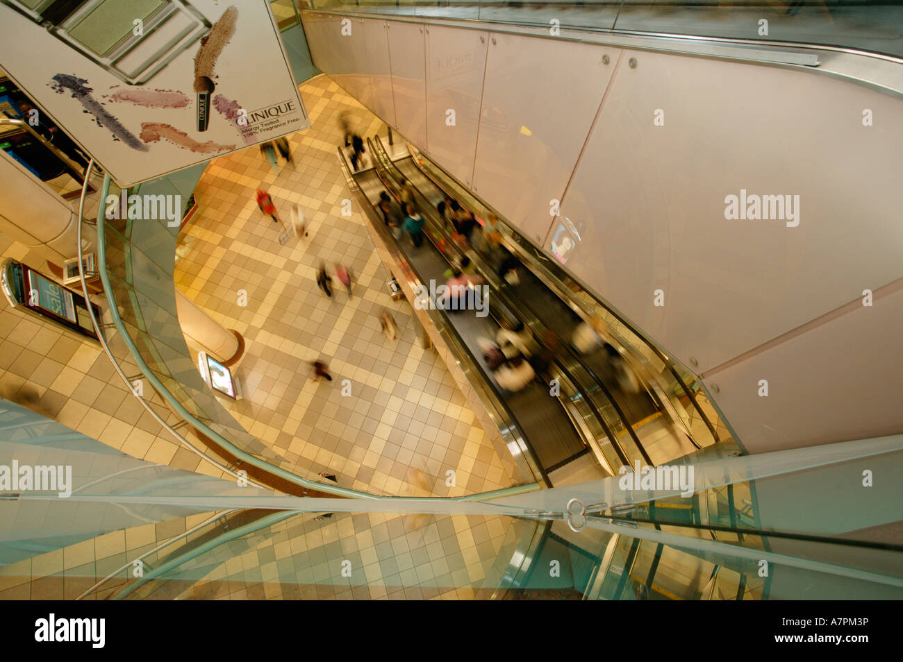 Escalators with shoppers descending into a multi storey Sandton