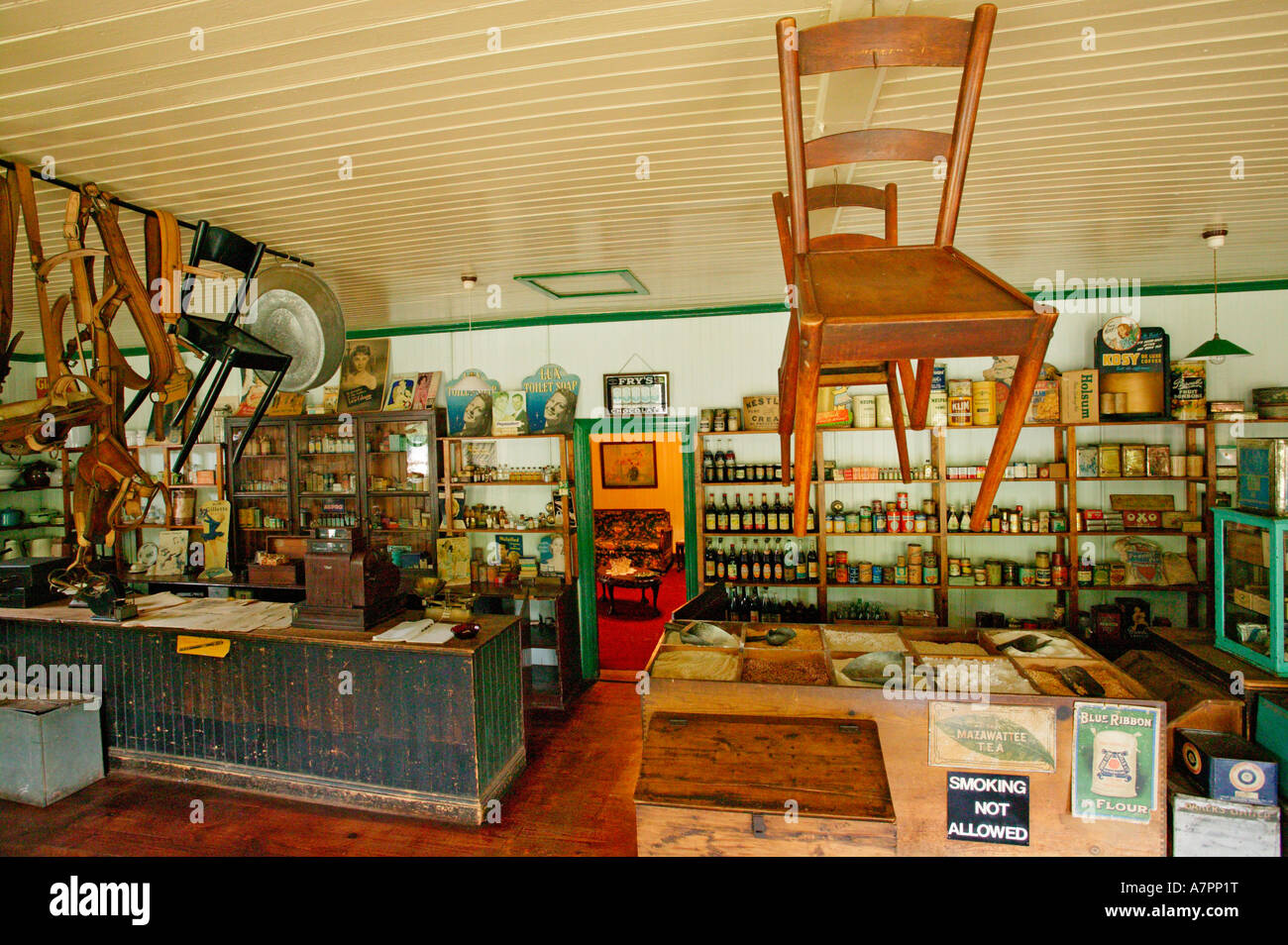The interior of the Dredzen general dealer store in Pilgrims Rest with goods displayed on the shelves and chairs hanging Stock Photo