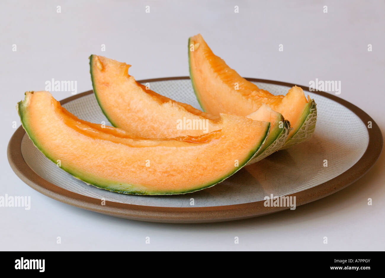 Spanspek Ranke Three slices fresh spanspek cantaloupe hi-res stock photography and ...
