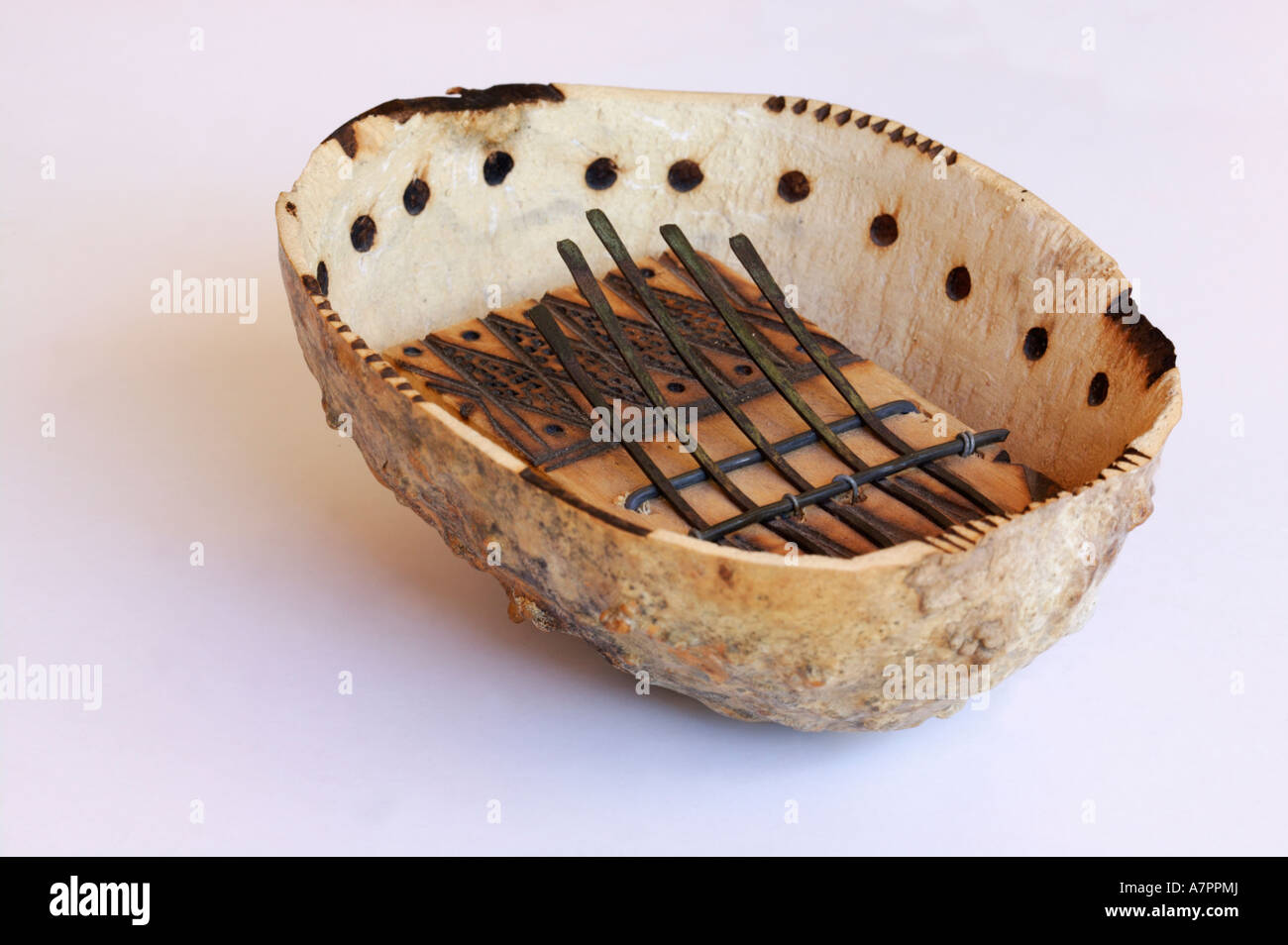 A decorated thumb piano made for the tourist trade Also known as a