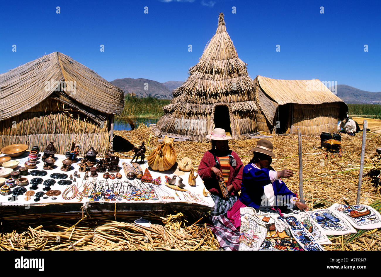 Peru, Puno Department, descendants of Uros Indians live on floating islands made with reed of Lake Titicaca Stock Photo