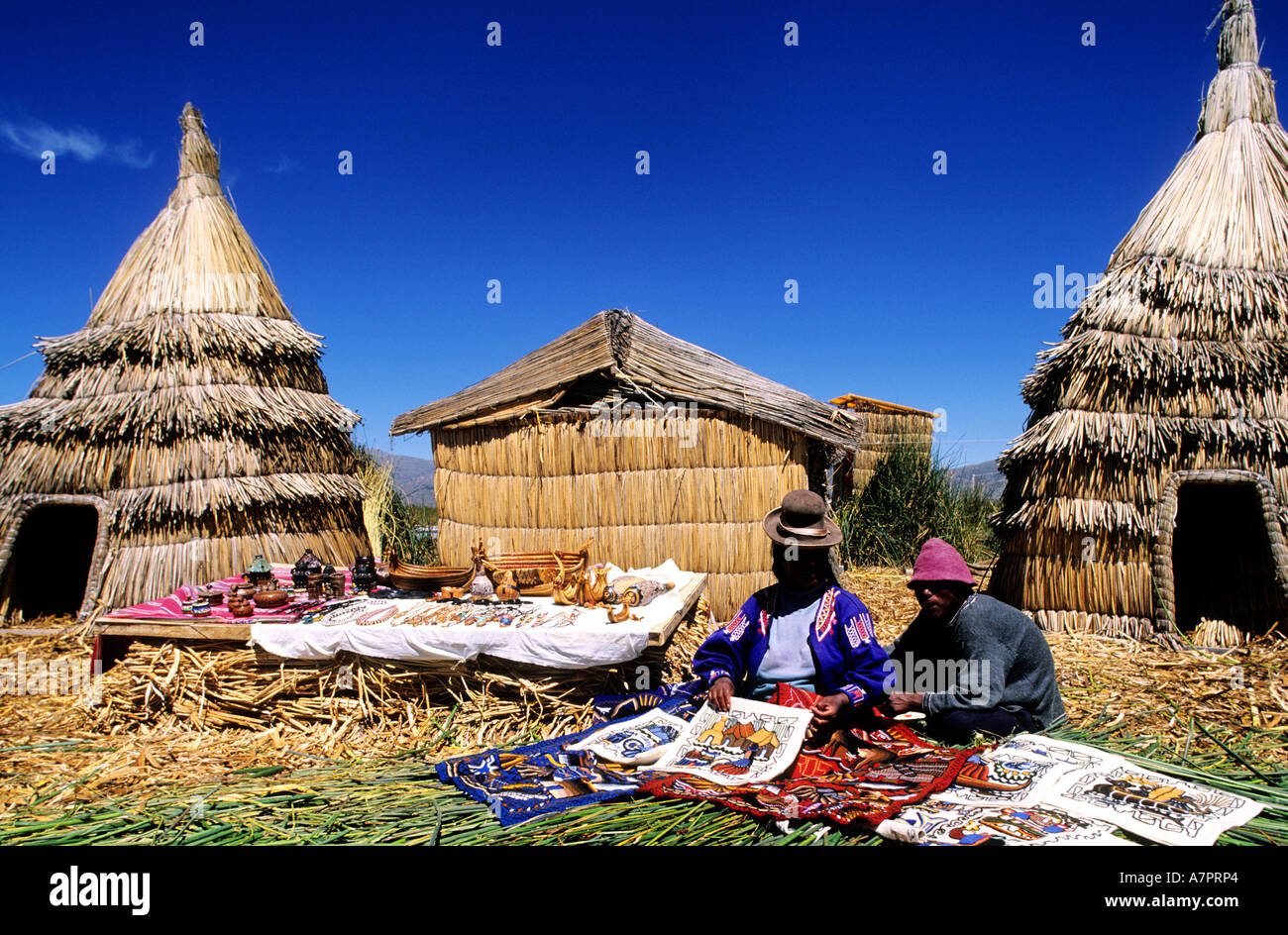 Peru, Puno Department, descendants of Uros Indians live on floating islands made with reed of Lake Titicaca Stock Photo