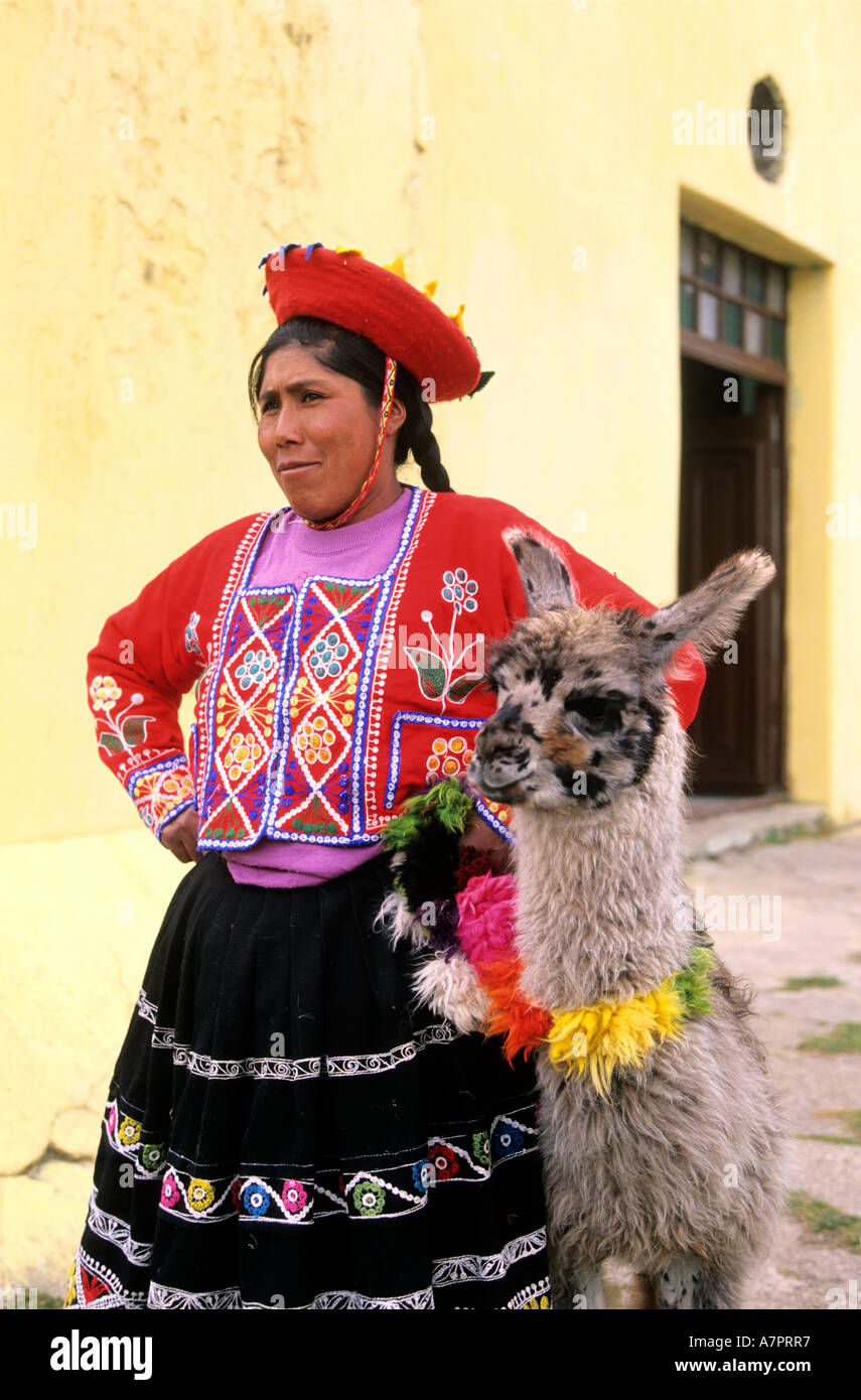 Peru, Altiplano, between Puno and Cuzco, an Indian and her son pose for photographs Stock Photo
