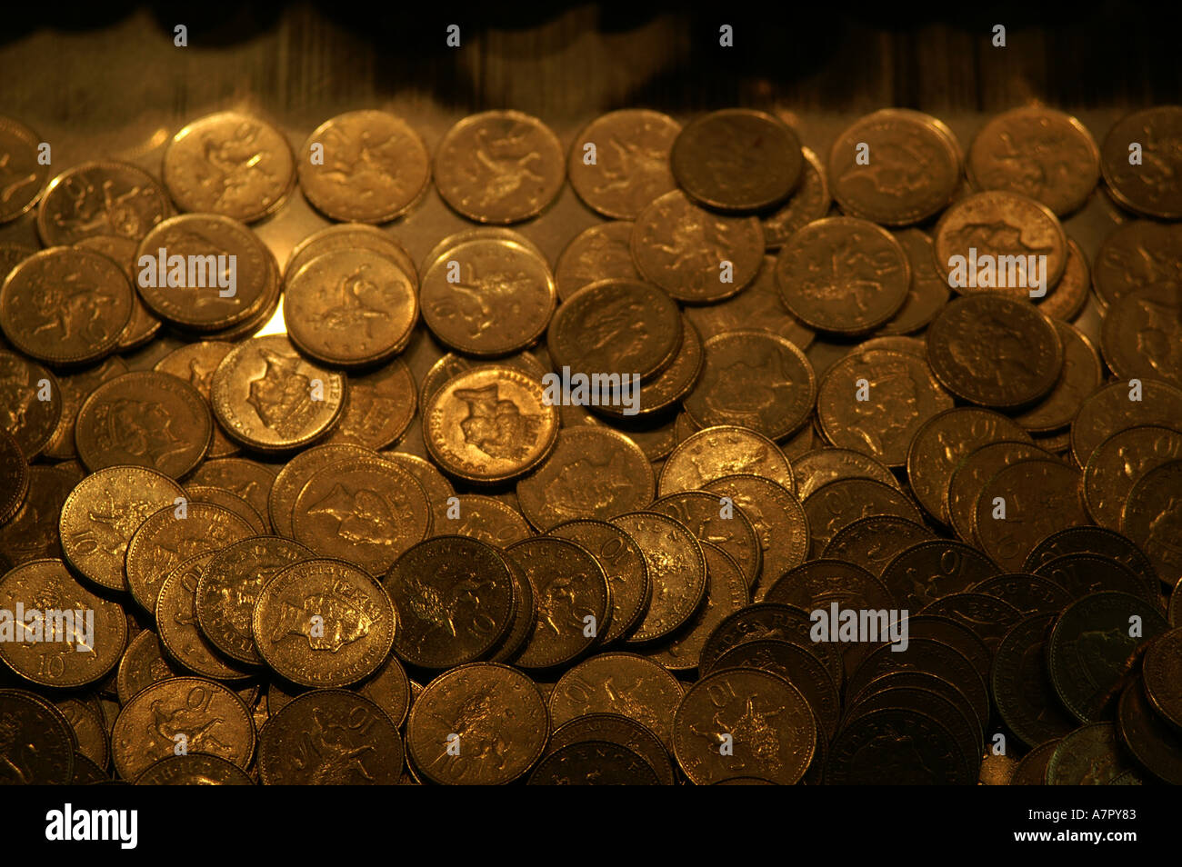 coins on gaming machine tray in palace pier Brighton and Hove Sussex