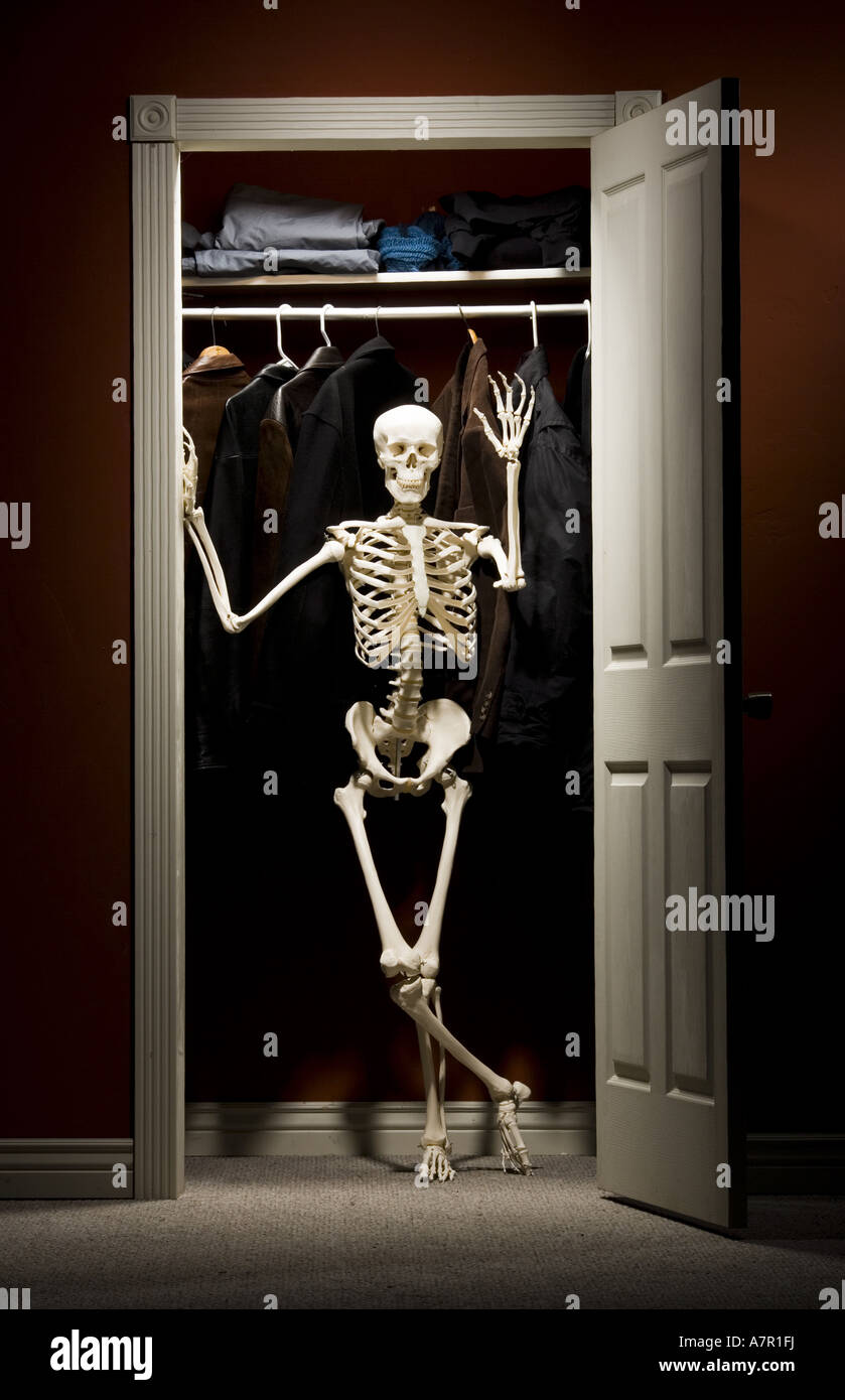 Skeleton standing in closet waving Stock Photo Alamy