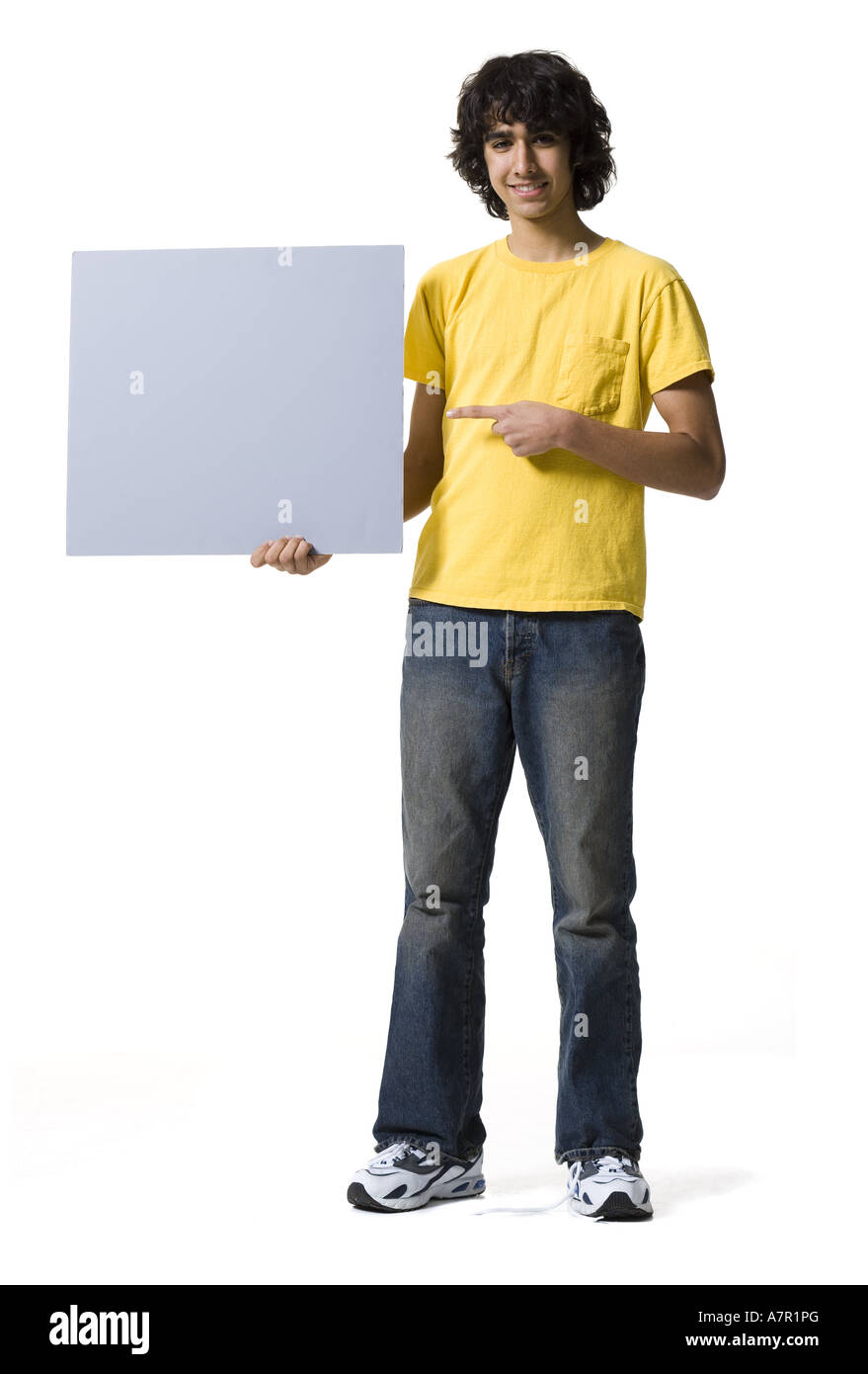 Teenage boy holding blank sign Stock Photo - Alamy