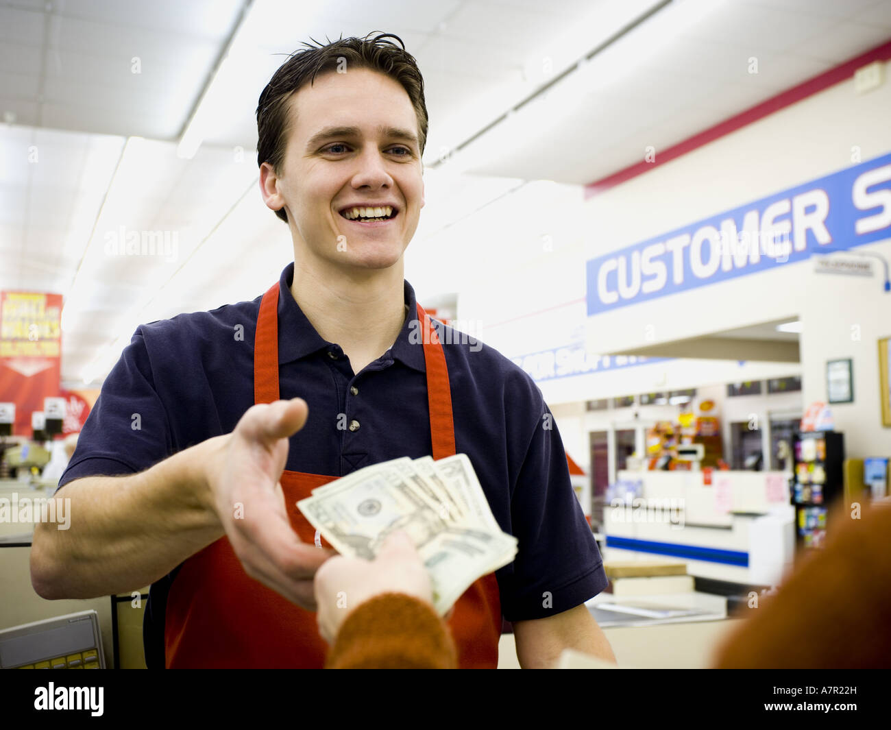 Taking money from cashier hires stock photography and images Alamy