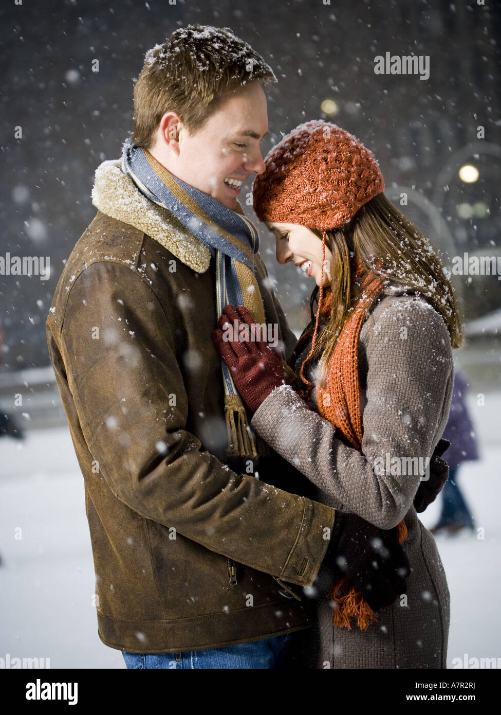 Couple embracing outdoors in winter Stock Photo - Alamy