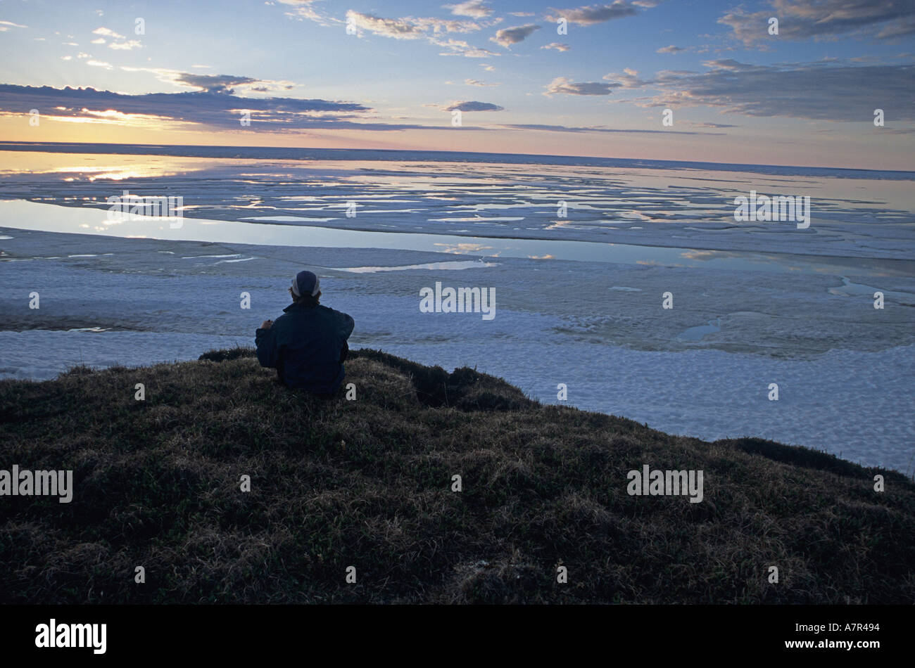 alaska, arctic national wildife refuge, beaufort sea, contemplating the end of the earth where land meets the beaufort sea 2 am Stock Photo