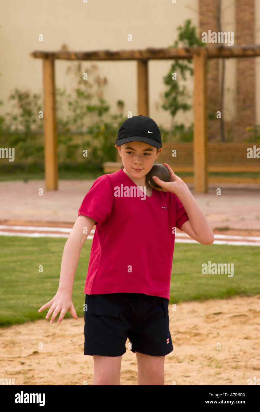 school child about to throw the shot put Stock Photo