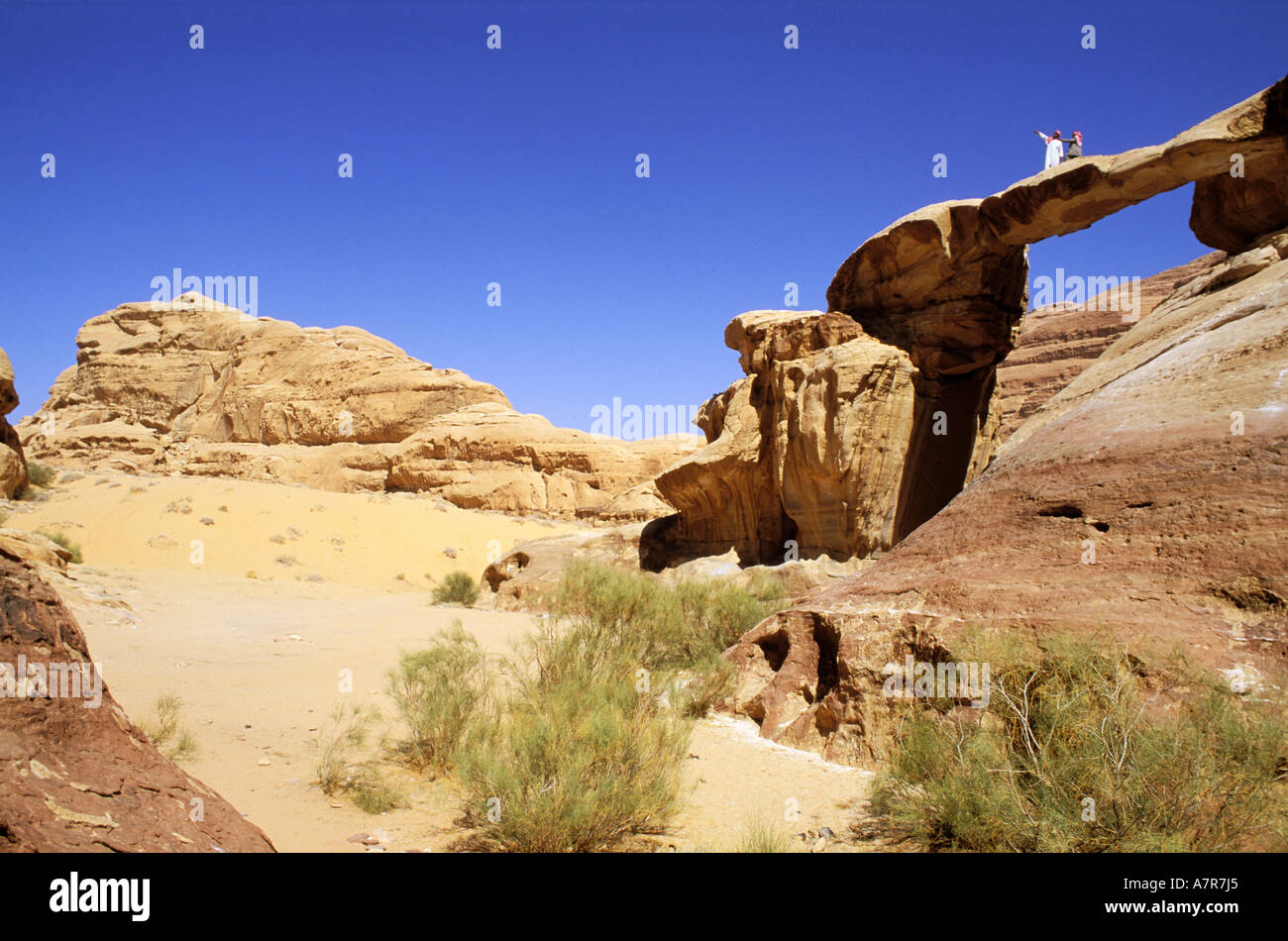 Jordan, Wadi Rum, Bedouins on the stone bridge of Um Fruth Stock Photo