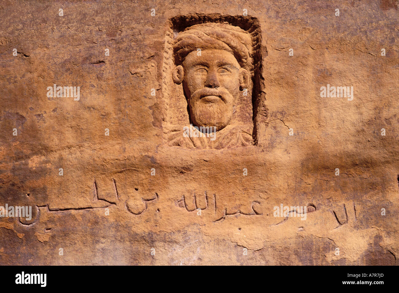 Jordan, Wadi Rum, engraved portrait in the rock of Laurence of Arabia Stock Photo