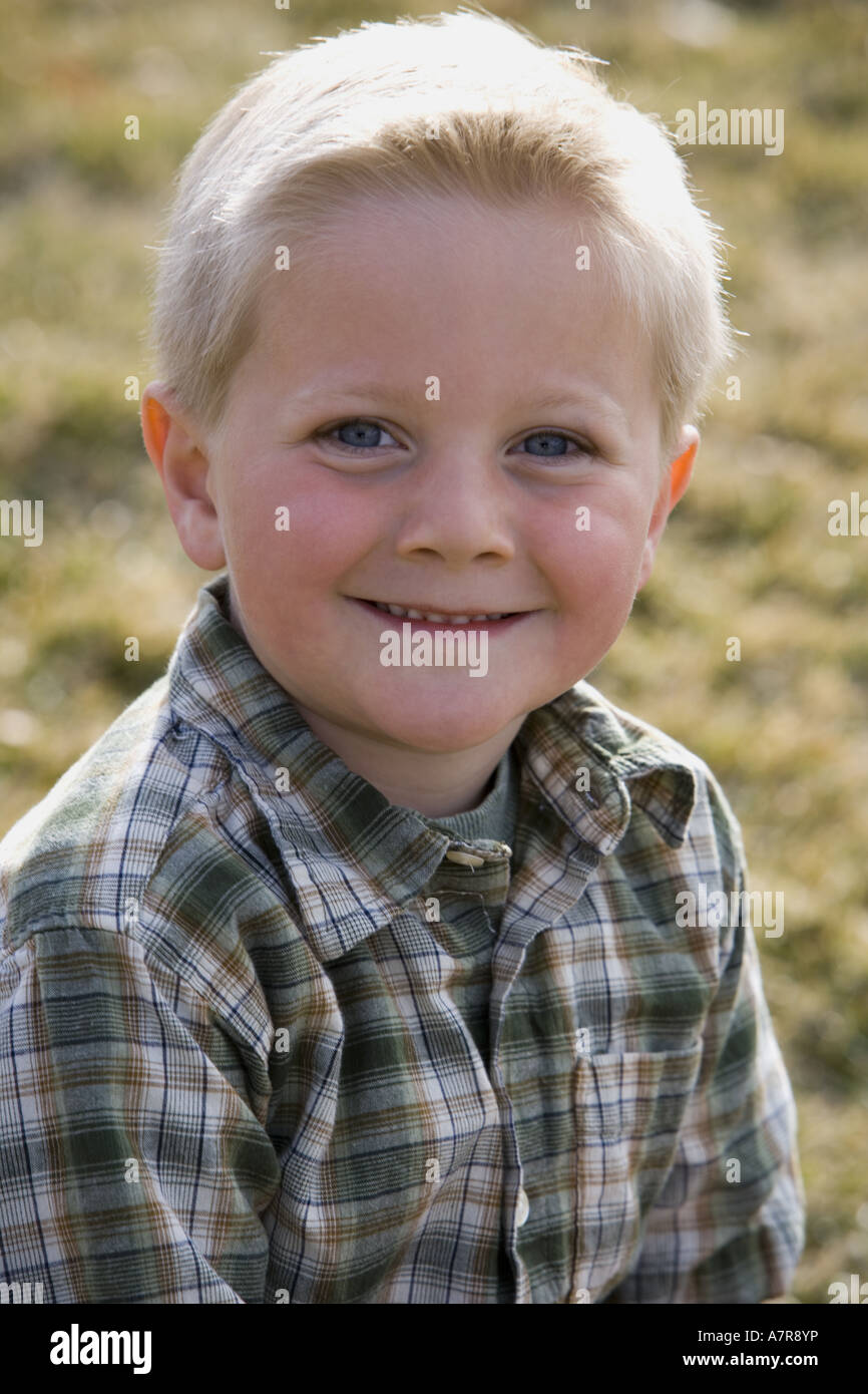 Portrait of a boy smiling outdoors Stock Photo - Alamy