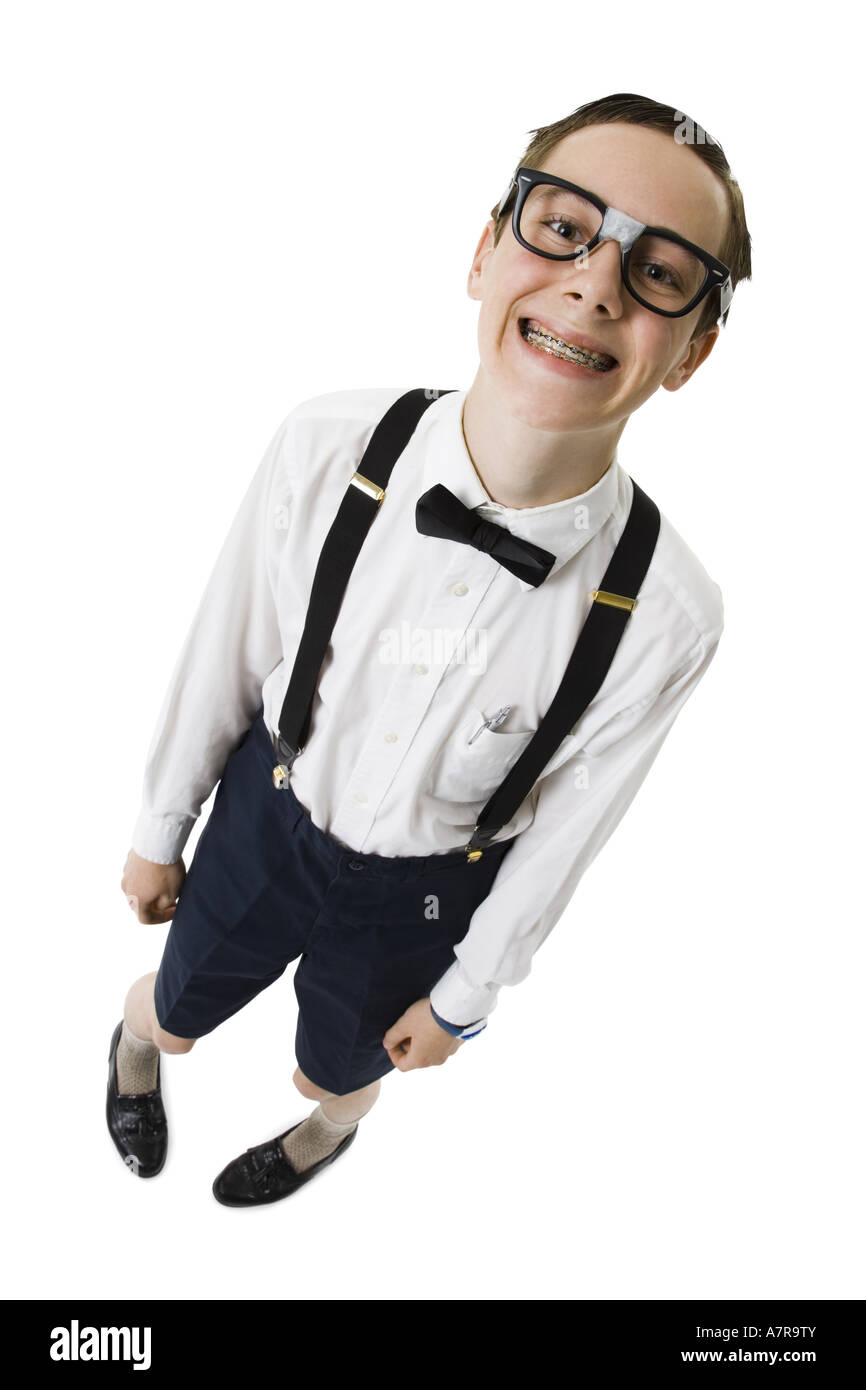Male nerd with suspenders and tape on eyeglasses smiling with braces