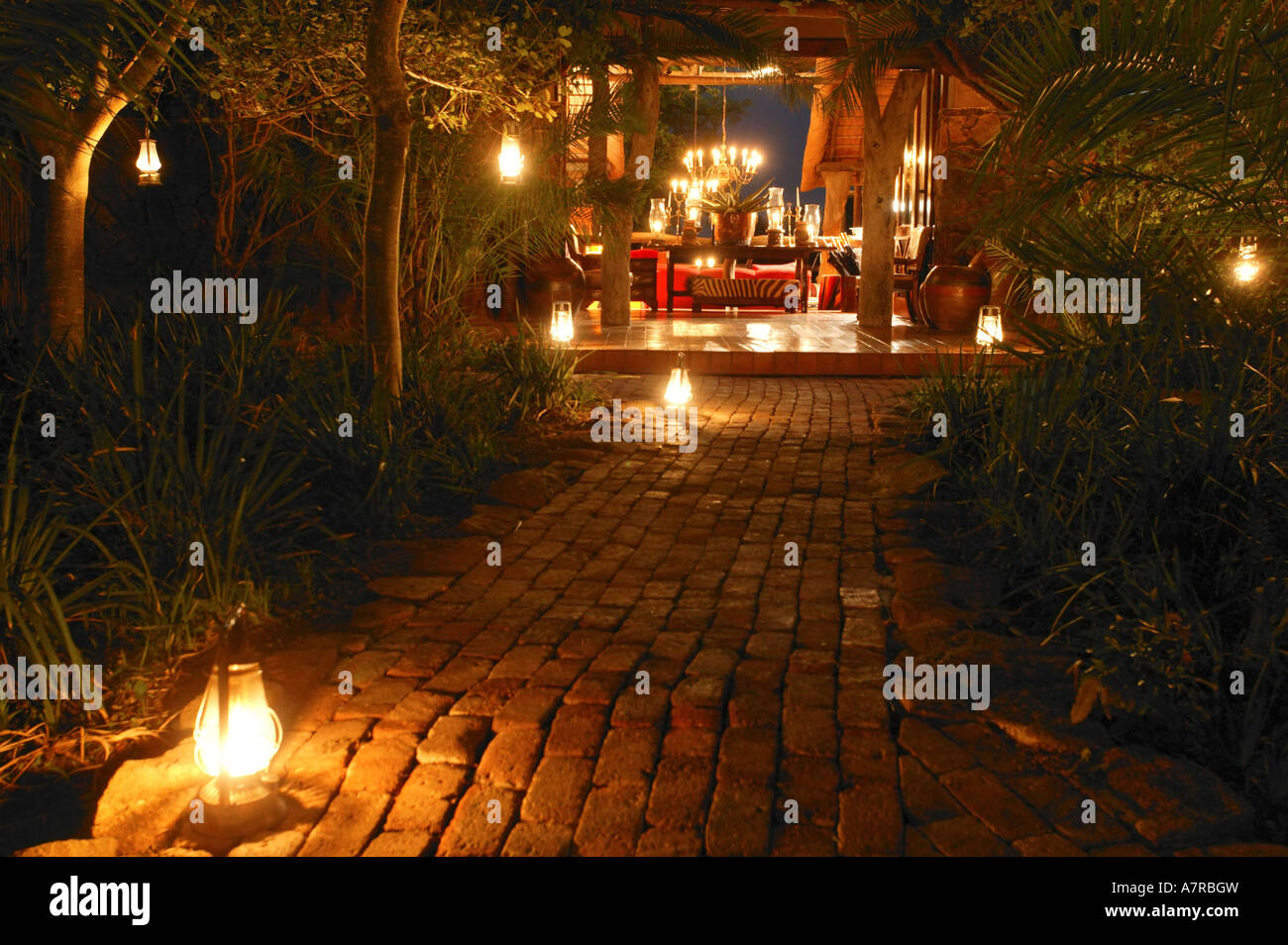 The entrance to Singita Ebony Lodge lit by paraffin lanterns Singita Game Reserve Sabi Sand Mpumalanga South Africa Stock Photo