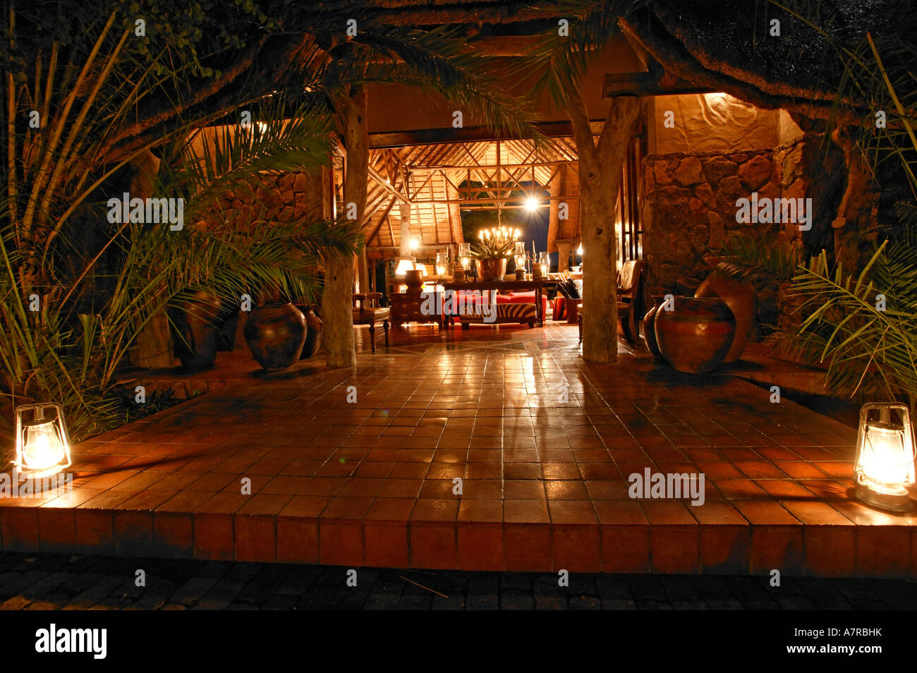 The entrance to Singita Ebony Lodge lit by paraffin lanterns Singita Game Reserve Sabi Sand Mpumalanga South Africa Stock Photo