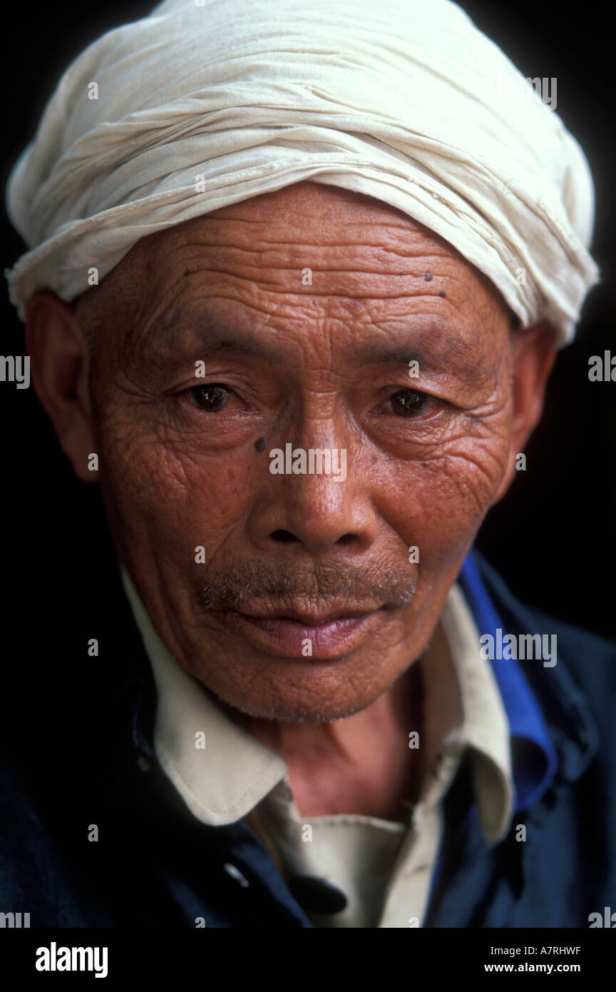 China Hubei Province Portrait of farmer in doorway of old home in Yao Ping village near Wushan Stock Photo