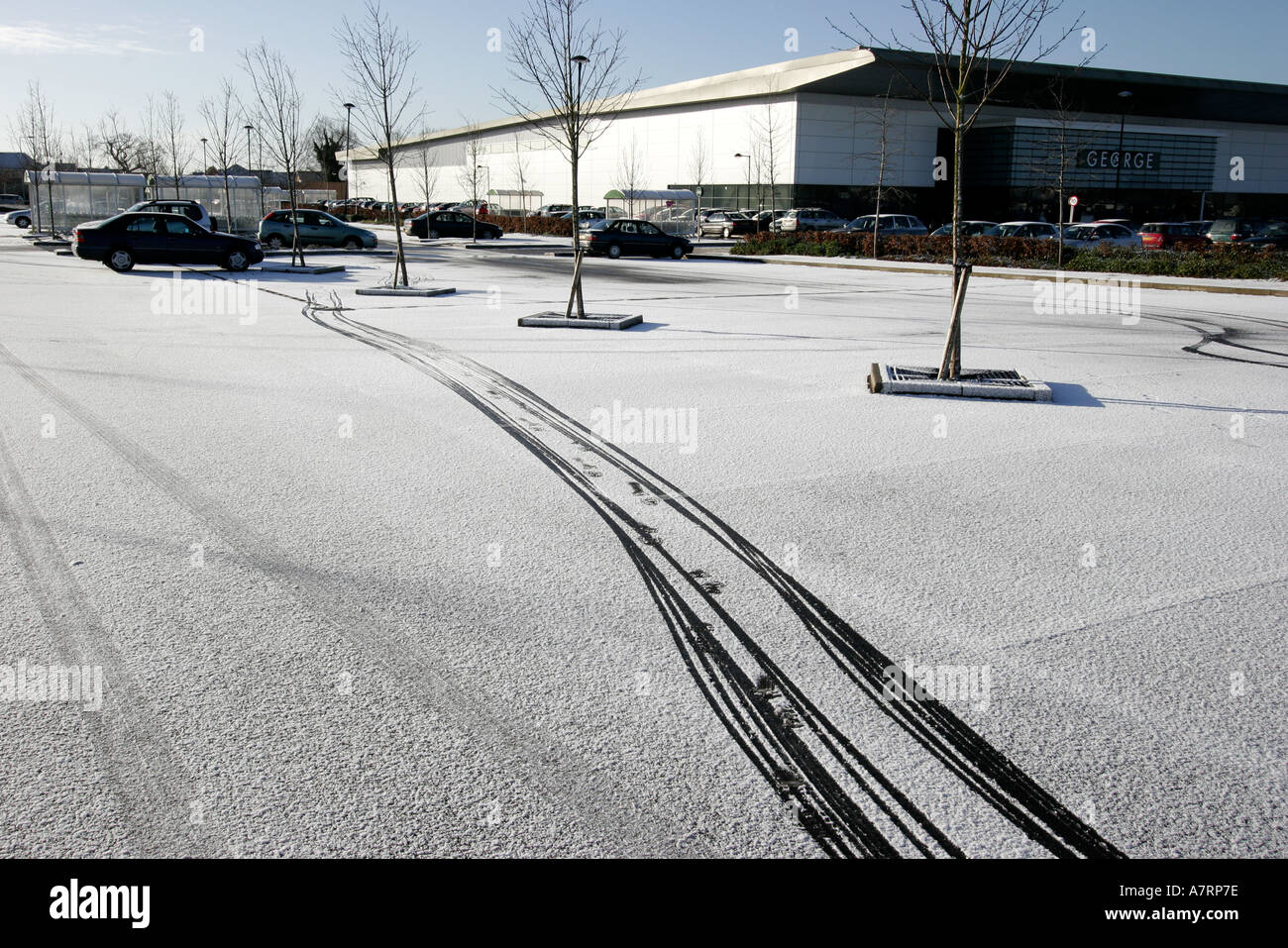 Tyre tracks in the snow supermarket car park Stock Photo - Alamy