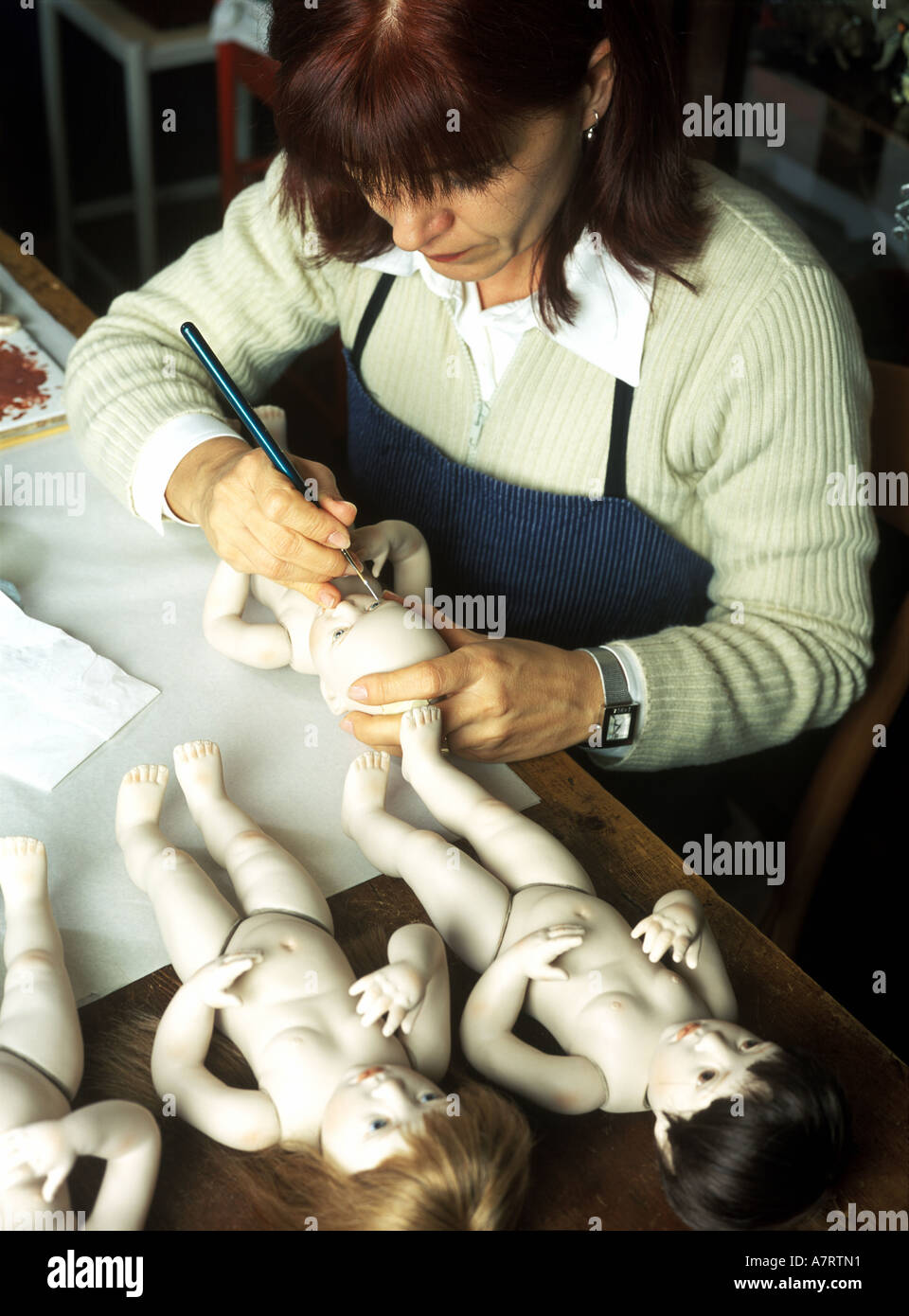 Italy, Veneto, Venice, Beatricia Perini (Model Release OK), making of porcelain dolls Stock Photo