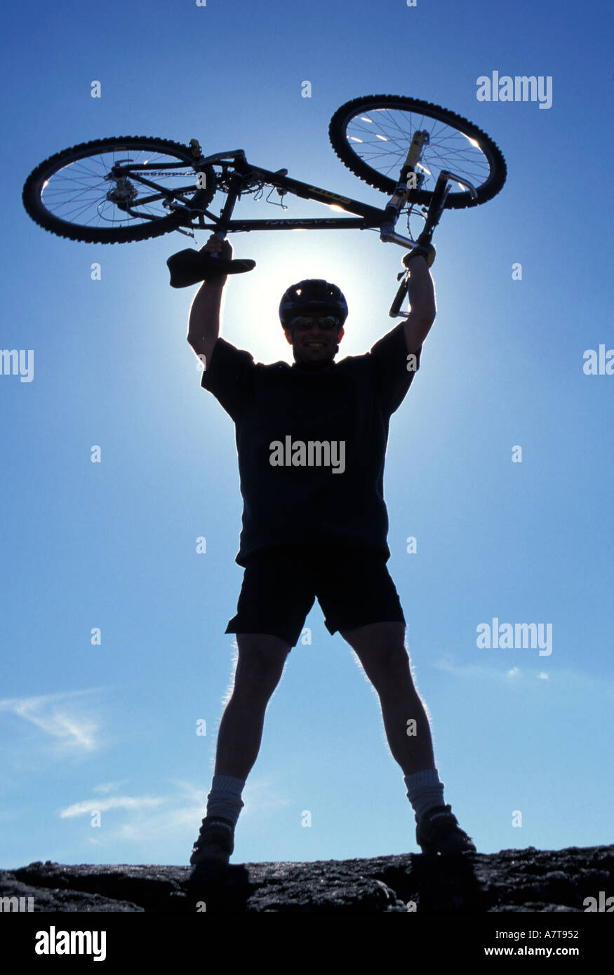 Man Holding Bike Above His Head Stock Photo Alamy