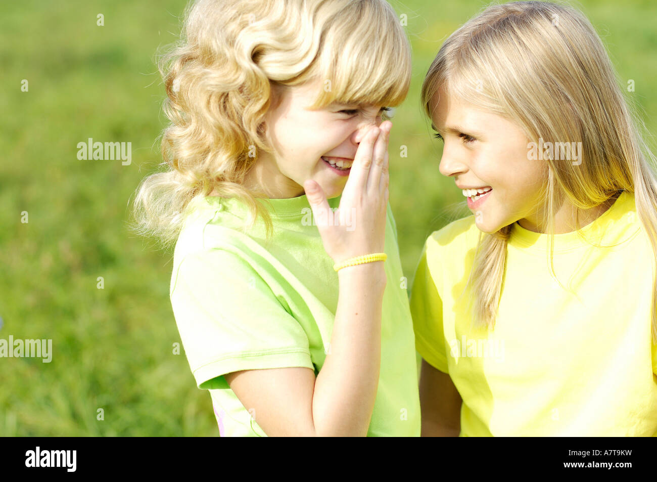 Close-up of two girls smiling Stock Photo - Alamy