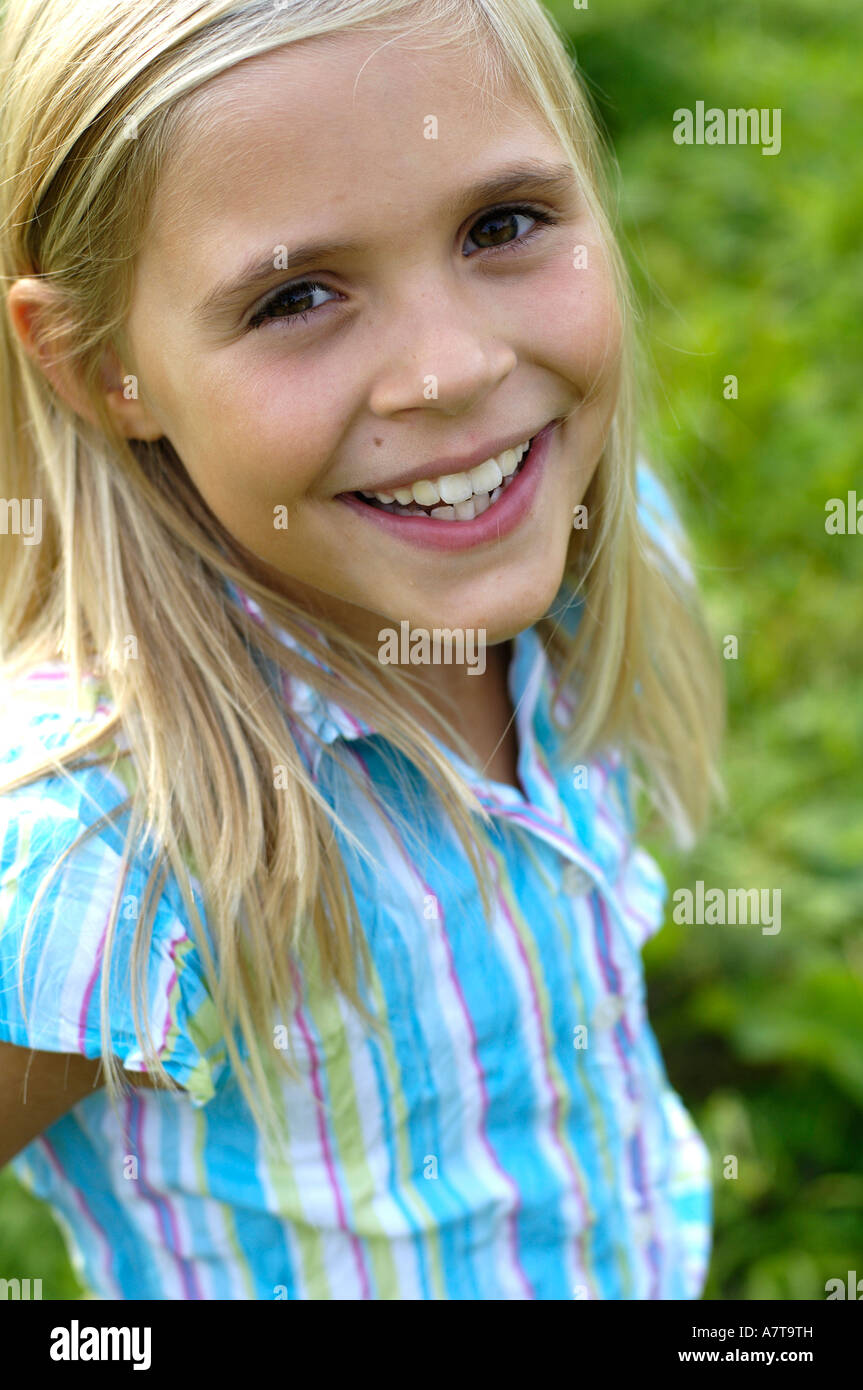 Girl smiling at camera Stock Photo - Alamy