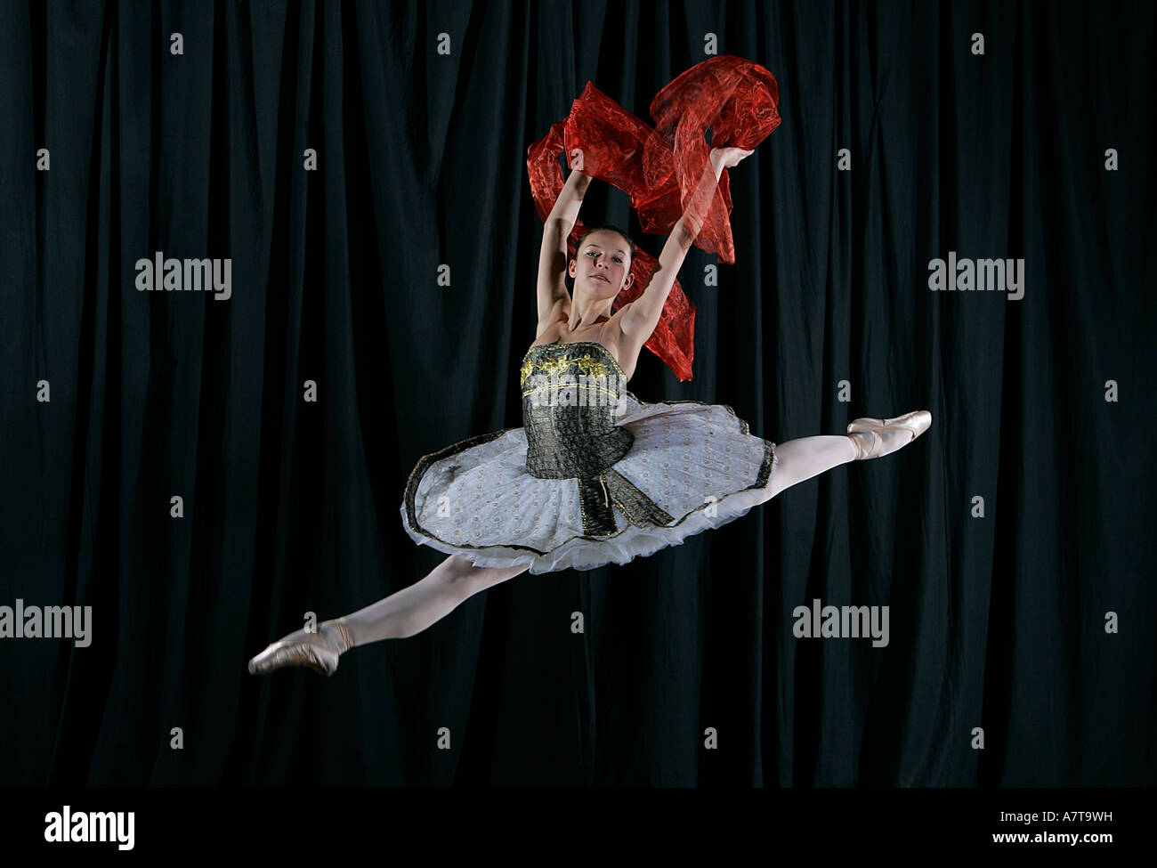 Ballerina leaping dance show performance Stock Photo