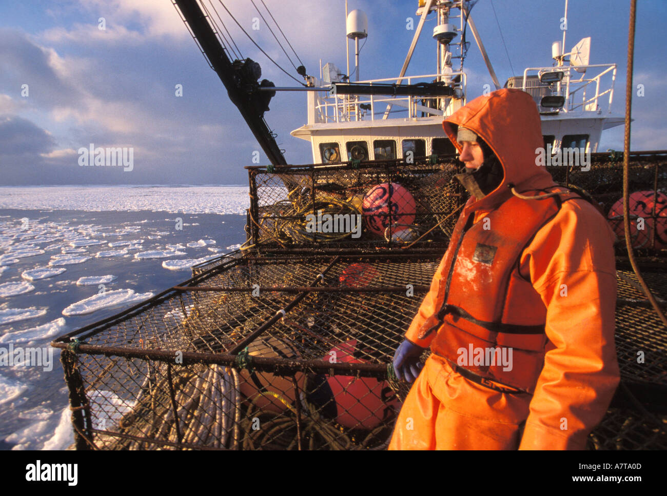 Commercial Crab Fisherman on a boat surrounded by sea ice Alaska