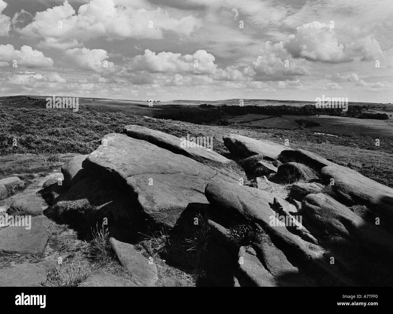 monochrome of the peak district in derbyshire overlooking sandstone rock formations near sheffield with storm clouds in the back Stock Photo