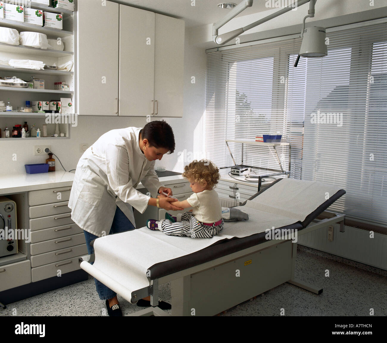 Doctor giving injections child hi-res stock photography and images - Alamy