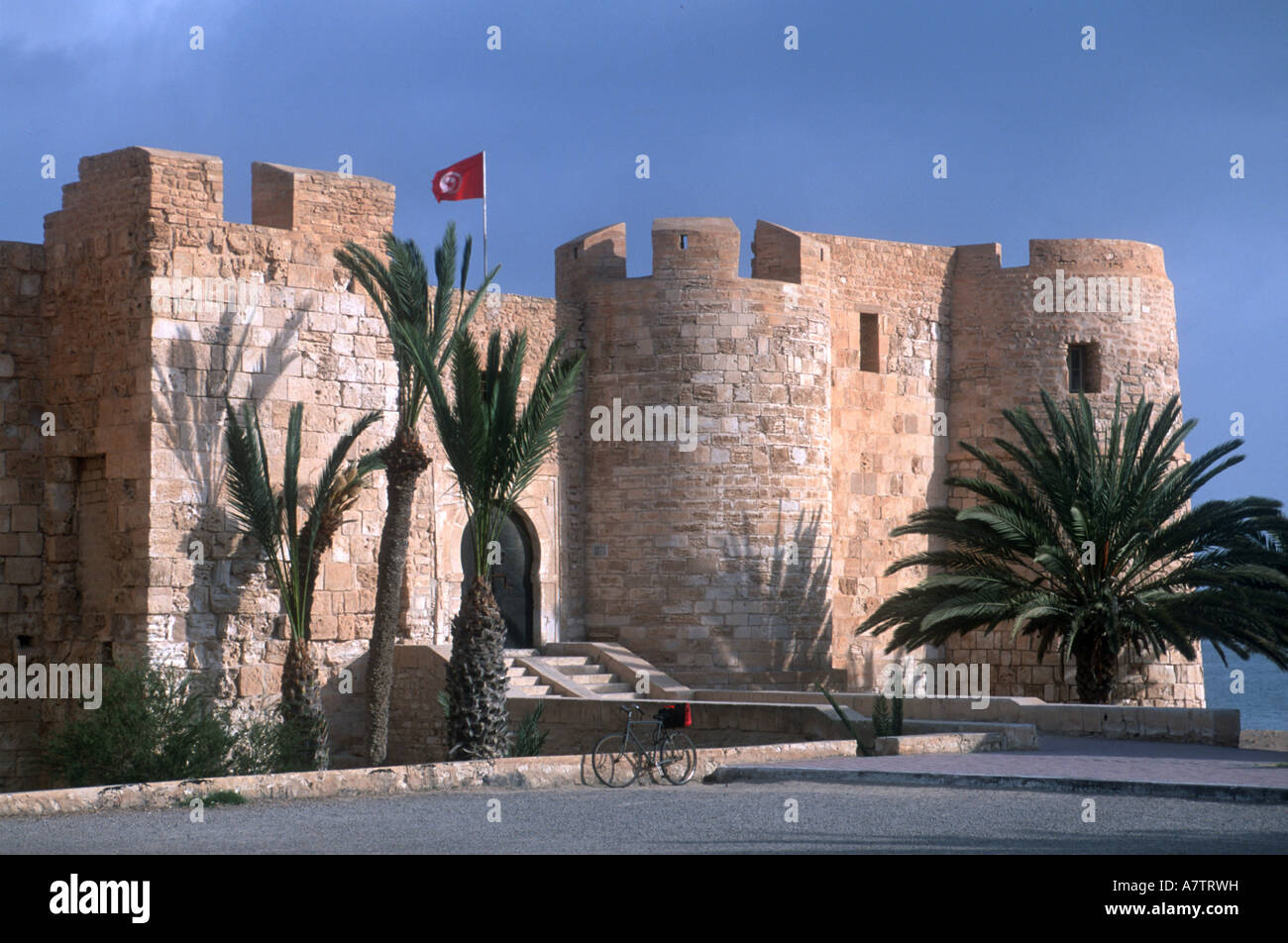 Castle on roadside under clear blue sky, Bordj El Kebir, Djerba, Tunisia Stock Photo