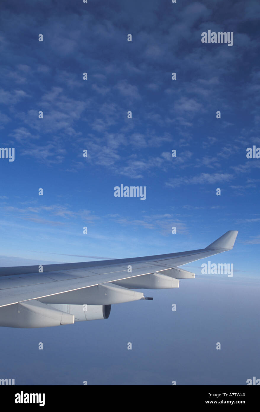 Somewhere over Pacific Ocean, wing of Airbus A-340 Stock Photo
