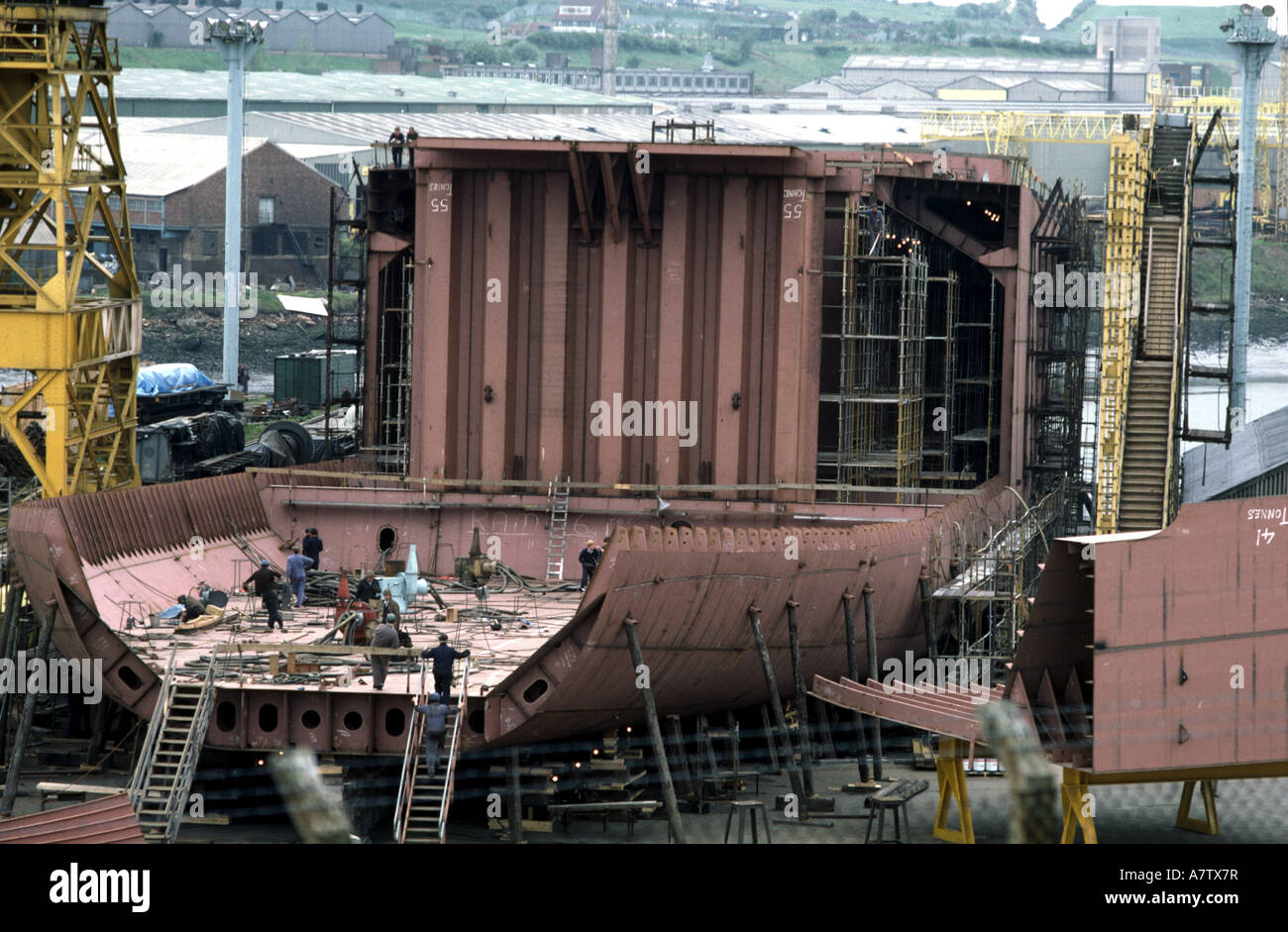 men and women leaving a shift at a shipbuilding factory Stock Photo - Alamy