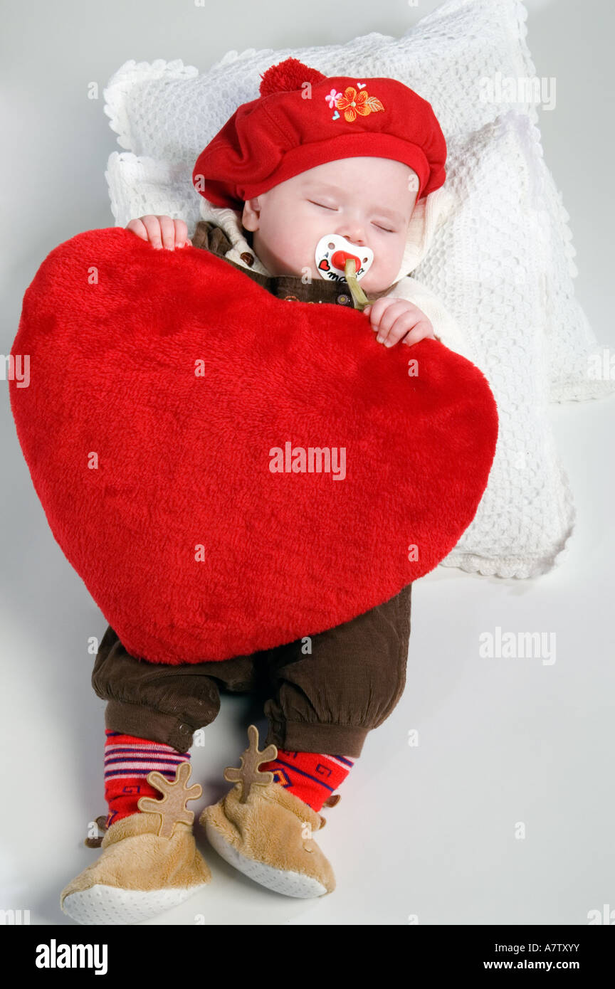 baby holding cushion