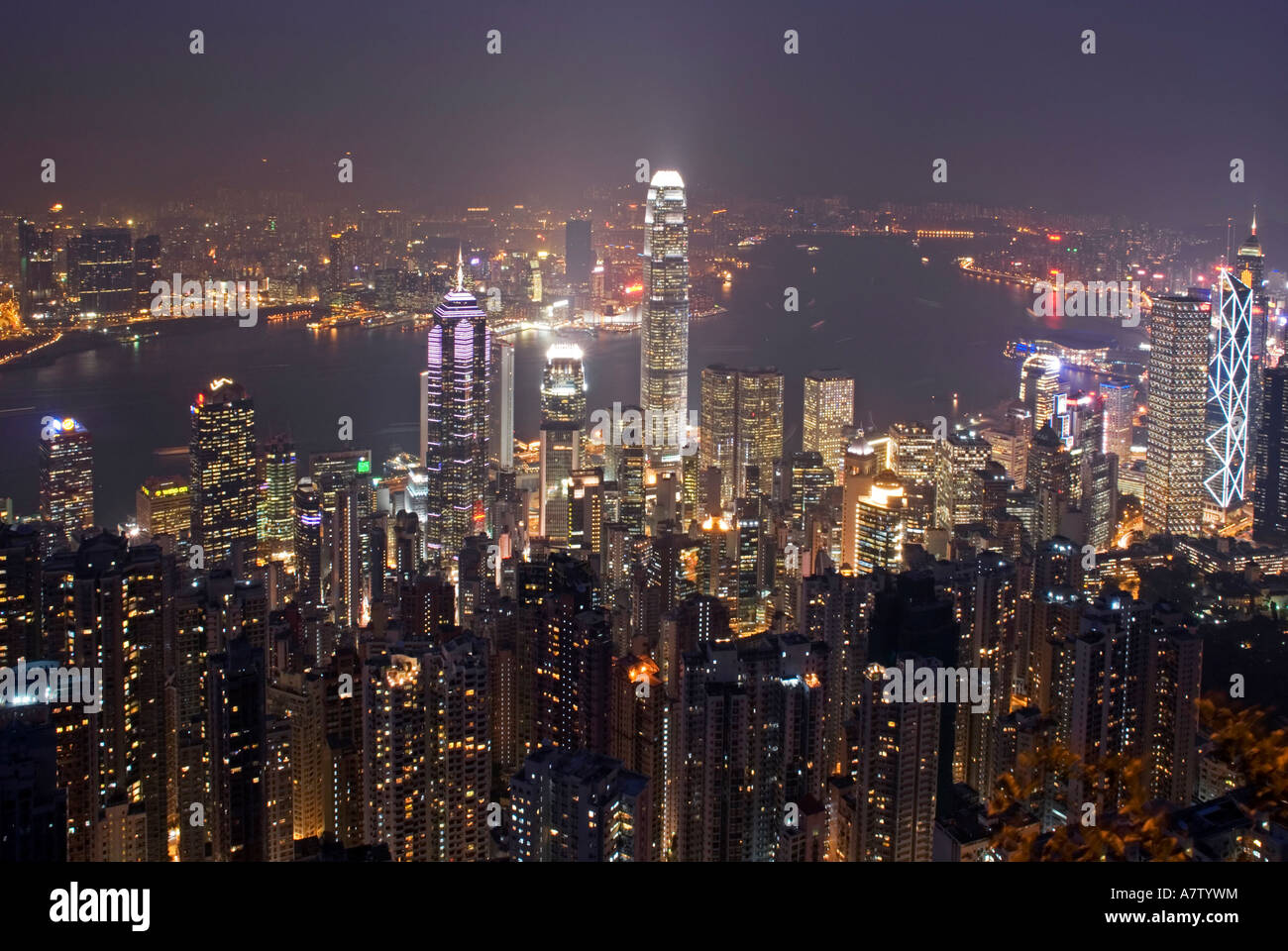 City lit up at waterfront, Hong Kong, China Stock Photo